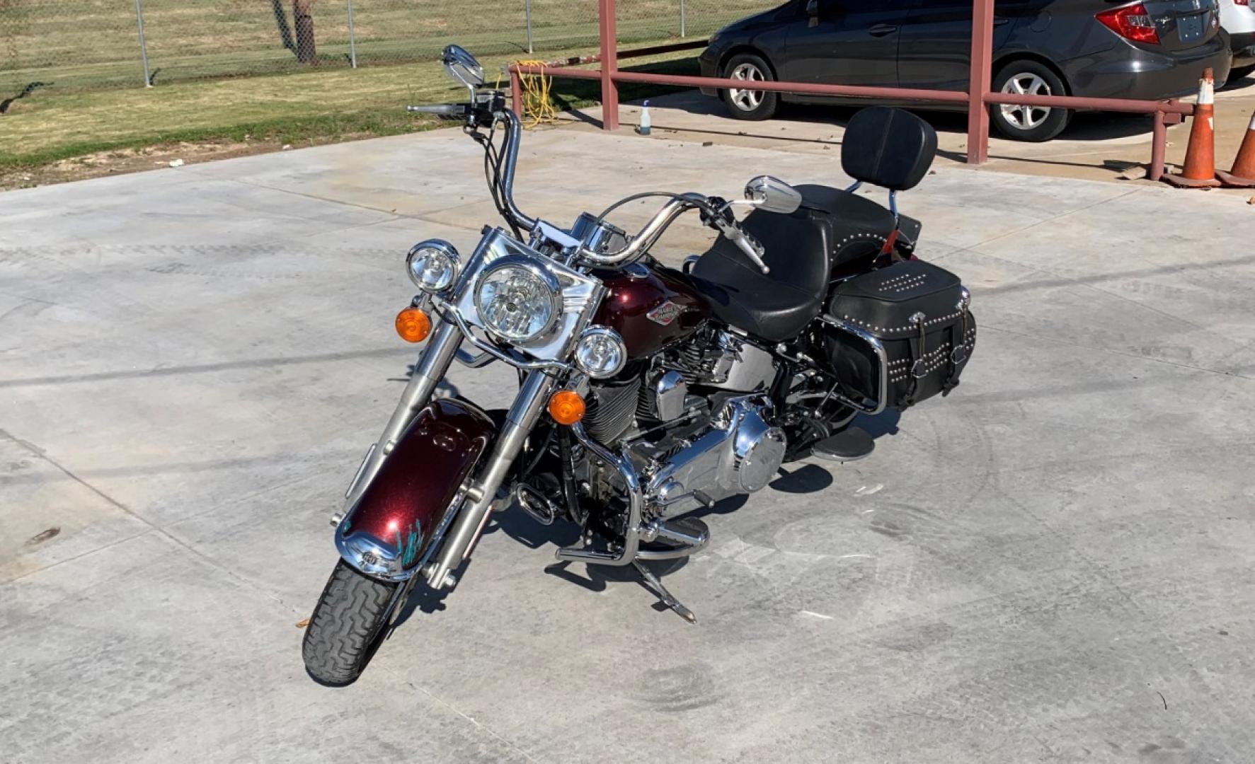 2009 PURPLE Harley-Davidson FLSTC - (1HD1BW5199Y) , located at 17760 HWY 62, MORRIS, 74445, 35.609104, -95.877060 - 2009 HARLEY- DAVIDSON FLSTC HERITAGE SOFTAIL 1584CC FEATURES CRUISE CONTROL, CHROME PASSING LAMPS, CHROME STAGGERED SHORTY EXHAUST WITH DUAL MUFFLERS, STUDDED LEATHER SADDLEBAGS, AND A FULL WINDSHIELD. A SMOOTH RIDE FOR LONG-RANGE TOURING COMFORT. IT RUNS GREAT !! ONLY 14,596 MILES. ** REBUILT TITLE - Photo#0