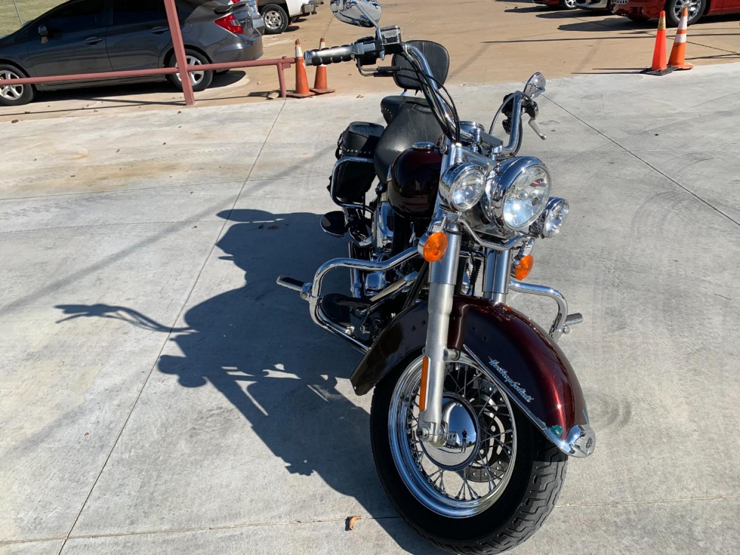 2009 PURPLE Harley-Davidson FLSTC - (1HD1BW5199Y) , located at 17760 HWY 62, MORRIS, 74445, 35.609104, -95.877060 - 2009 HARLEY- DAVIDSON FLSTC HERITAGE SOFTAIL 1584CC FEATURES CRUISE CONTROL, CHROME PASSING LAMPS, CHROME STAGGERED SHORTY EXHAUST WITH DUAL MUFFLERS, STUDDED LEATHER SADDLEBAGS, AND A FULL WINDSHIELD. A SMOOTH RIDE FOR LONG-RANGE TOURING COMFORT. IT RUNS GREAT !! ONLY 14,596 MILES. ** REBUILT TITLE - Photo#2