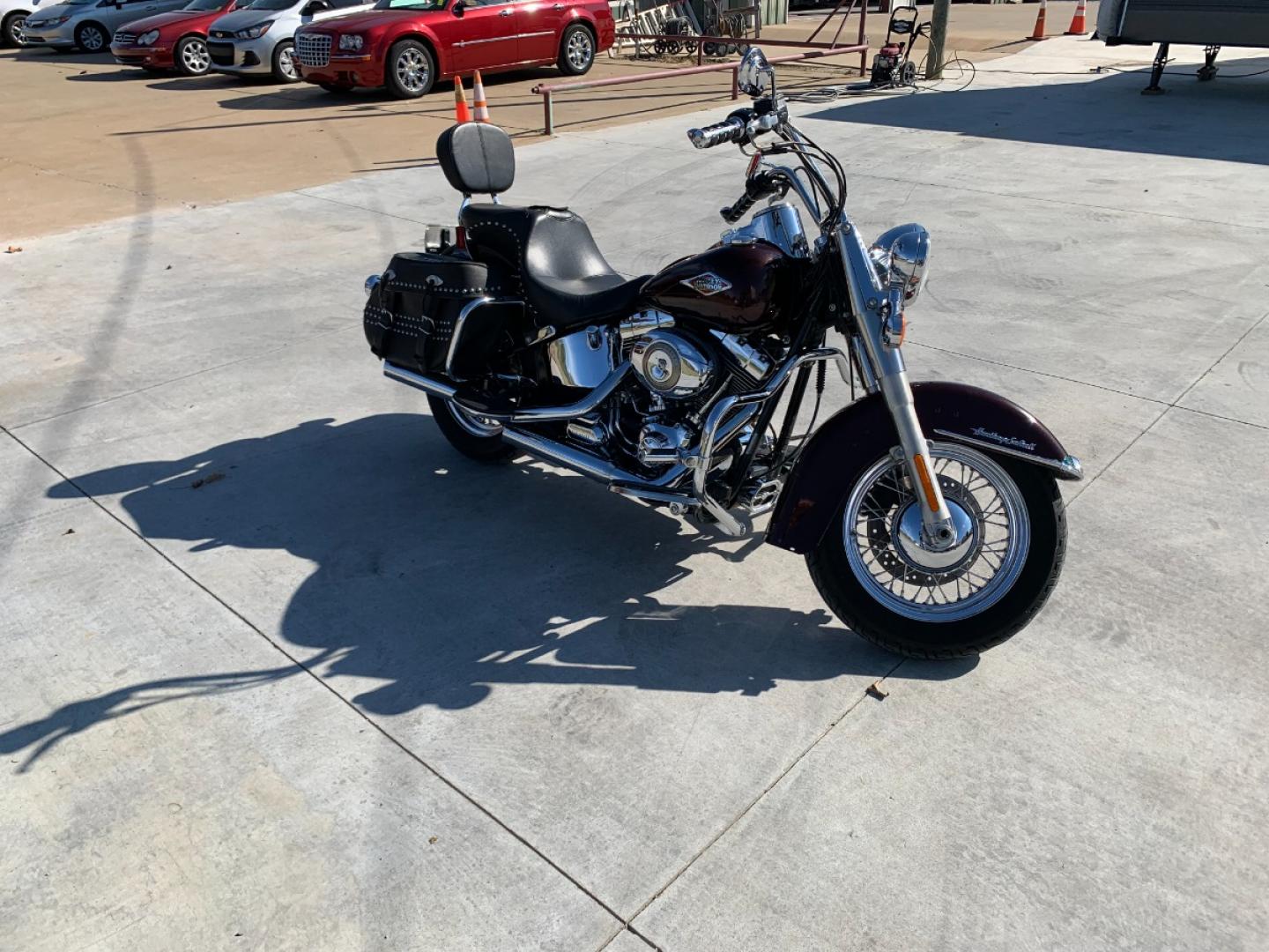 2009 PURPLE Harley-Davidson FLSTC - (1HD1BW5199Y) , located at 17760 HWY 62, MORRIS, 74445, 35.609104, -95.877060 - 2009 HARLEY- DAVIDSON FLSTC HERITAGE SOFTAIL 1584CC FEATURES CRUISE CONTROL, CHROME PASSING LAMPS, CHROME STAGGERED SHORTY EXHAUST WITH DUAL MUFFLERS, STUDDED LEATHER SADDLEBAGS, AND A FULL WINDSHIELD. A SMOOTH RIDE FOR LONG-RANGE TOURING COMFORT. IT RUNS GREAT !! ONLY 14,596 MILES. ** REBUILT TITLE - Photo#3