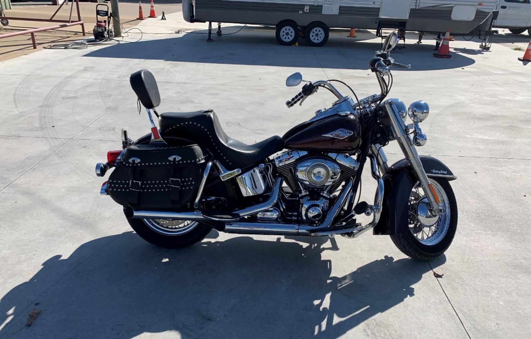 2009 PURPLE Harley-Davidson FLSTC - (1HD1BW5199Y) , located at 17760 HWY 62, MORRIS, 74445, 35.609104, -95.877060 - 2009 HARLEY- DAVIDSON FLSTC HERITAGE SOFTAIL 1584CC FEATURES CRUISE CONTROL, CHROME PASSING LAMPS, CHROME STAGGERED SHORTY EXHAUST WITH DUAL MUFFLERS, STUDDED LEATHER SADDLEBAGS, AND A FULL WINDSHIELD. A SMOOTH RIDE FOR LONG-RANGE TOURING COMFORT. IT RUNS GREAT !! ONLY 14,596 MILES. ** REBUILT TITLE - Photo#4