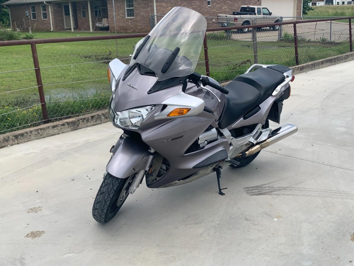 2003 Silver Honda ST1300 ST1300 (JH2SC51103M) with an 1261CC engine, 5 SPEED transmission, located at 17760 HWY 62, MORRIS, 74445, 35.609104, -95.877060 - 2003 HONDA ST1300 1261CC 5-SPEED TRANSMISSION WITH AN ELECTRIC START, POWER-ADJUSTABLE LIGHTS, POWER-ADJUSTABLE WINDSHIELD, NICE CLEAN TOURING SPORTS BIKE. ONLY 17,093 MILES, MARATHON TIRES, IT HAS REBUILT TITLE DUE TO A SMALL ACCIDENT. LIGHT SCRAPES AS SHOWN IN PICTURES. WE OFFER A FREE CARFAX ON - Photo#1