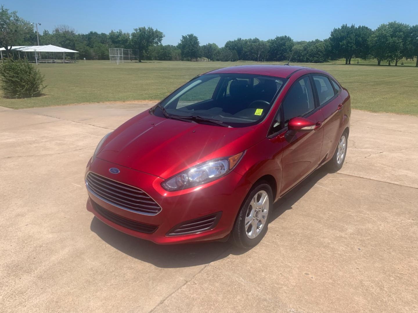 2014 RED Ford Fiesta SE Sedan (3FADP4BJ6EM) with an 1.6L L4 DOHC 16V engine, located at 17760 Hwy 62, Morris, OK, 74445, (918) 733-4887, 35.609104, -95.877060 - 2014 FORD FIESTA SE 1.6L 4 CYLINDER FWD, FEATURES KEYLESS ENTRY REMOTE, POWER LOCKS, POWER WINDOWS, POWER MIRRORS, MANUAL SEATS, AM/FM STEREO, CD PLAYER, BLUETOOTH, CLOTH SEATS, CRUISE CONTROL, HANDS-FREE CALLING, VOICE COMMAND CONTROL, MULTI-FUNCTION STEERING WHEEL CONTROLS. 108,726 MILES 195/60R15 - Photo#0