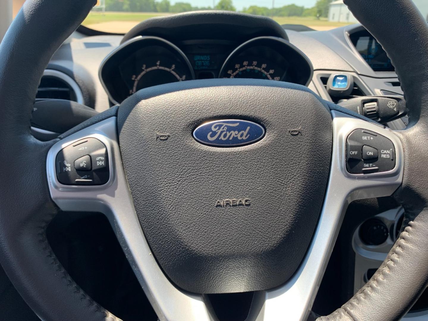 2014 RED Ford Fiesta SE Sedan (3FADP4BJ6EM) with an 1.6L L4 DOHC 16V engine, located at 17760 Hwy 62, Morris, OK, 74445, (918) 733-4887, 35.609104, -95.877060 - 2014 FORD FIESTA SE 1.6L 4 CYLINDER FWD, FEATURES KEYLESS ENTRY REMOTE, POWER LOCKS, POWER WINDOWS, POWER MIRRORS, MANUAL SEATS, AM/FM STEREO, CD PLAYER, BLUETOOTH, CLOTH SEATS, CRUISE CONTROL, HANDS-FREE CALLING, VOICE COMMAND CONTROL, MULTI-FUNCTION STEERING WHEEL CONTROLS. 108,726 MILES 195/60R15 - Photo#12