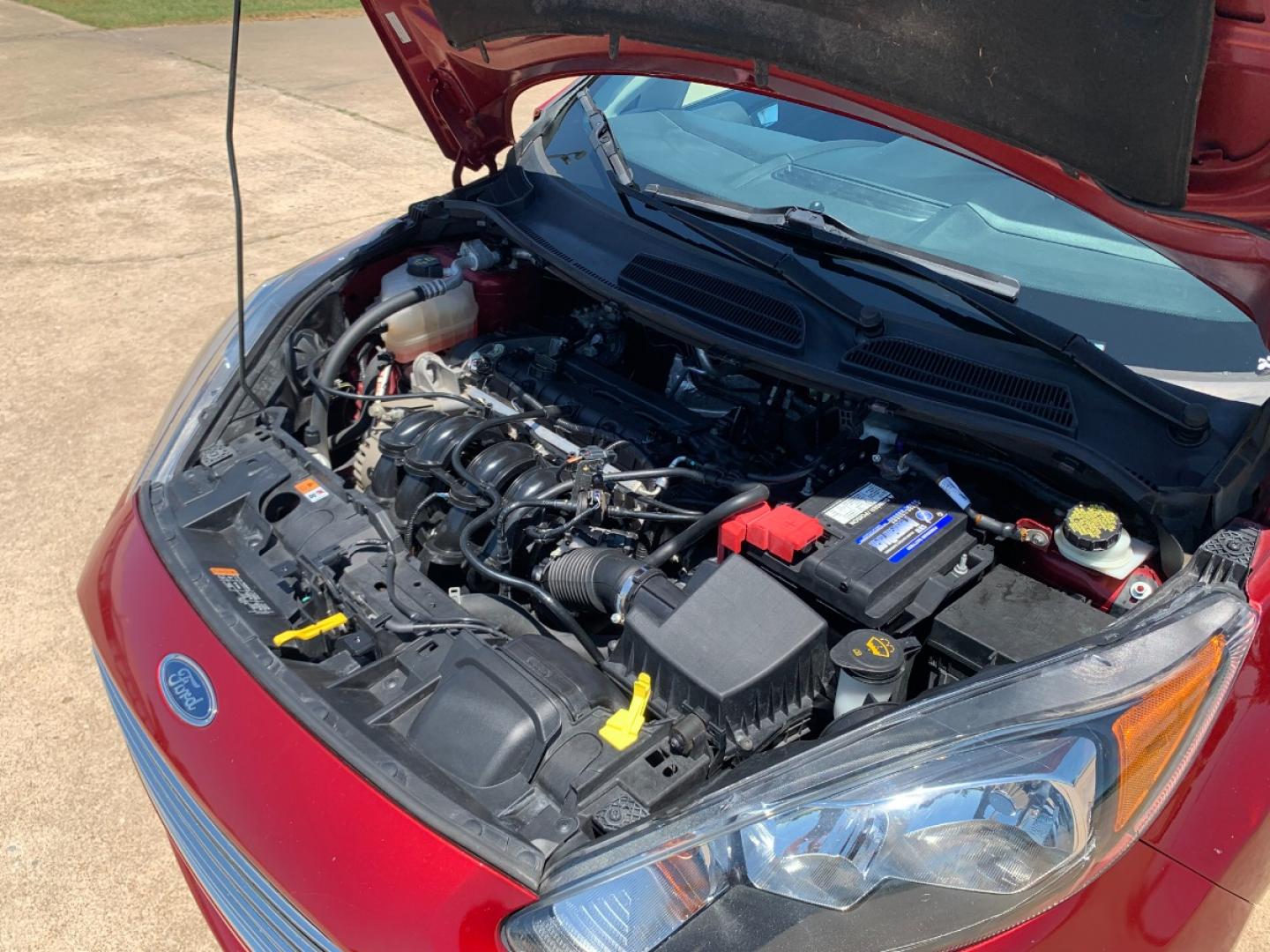 2014 RED Ford Fiesta SE Sedan (3FADP4BJ6EM) with an 1.6L L4 DOHC 16V engine, located at 17760 Hwy 62, Morris, OK, 74445, (918) 733-4887, 35.609104, -95.877060 - 2014 FORD FIESTA SE 1.6L 4 CYLINDER FWD, FEATURES KEYLESS ENTRY REMOTE, POWER LOCKS, POWER WINDOWS, POWER MIRRORS, MANUAL SEATS, AM/FM STEREO, CD PLAYER, BLUETOOTH, CLOTH SEATS, CRUISE CONTROL, HANDS-FREE CALLING, VOICE COMMAND CONTROL, MULTI-FUNCTION STEERING WHEEL CONTROLS. 108,726 MILES 195/60R15 - Photo#16