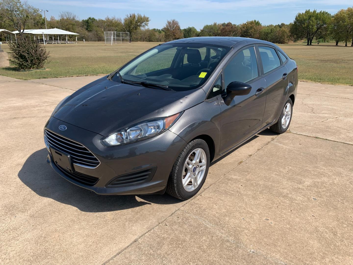 2017 GRAY Ford Fiesta SE Sedan (3FADP4BJXHM) with an 1.6L L4 DOHC 16V engine, located at 17760 Hwy 62, Morris, OK, 74445, (918) 733-4887, 35.609104, -95.877060 - 2017 FORD FIESTA SE 1.6L 4-CYLINDER FWD, RUNS ON GASOLINE, YOU WILL SAVE AT THE GAS PUMP WITH THIS FORD IT GETS 35 MPG. FEATURES A KEYLESS ENTRY REMOTE, POWER LOCKS, POWER WINDOWS, POWER MIRRORS, MANUAL SEATS, AM/FM STEREO, CD PLAYER, BLUETOOTH, CLOTH SEATS, CRUISE CONTROL, HANDS-FREE CALLING, VOICE - Photo#0