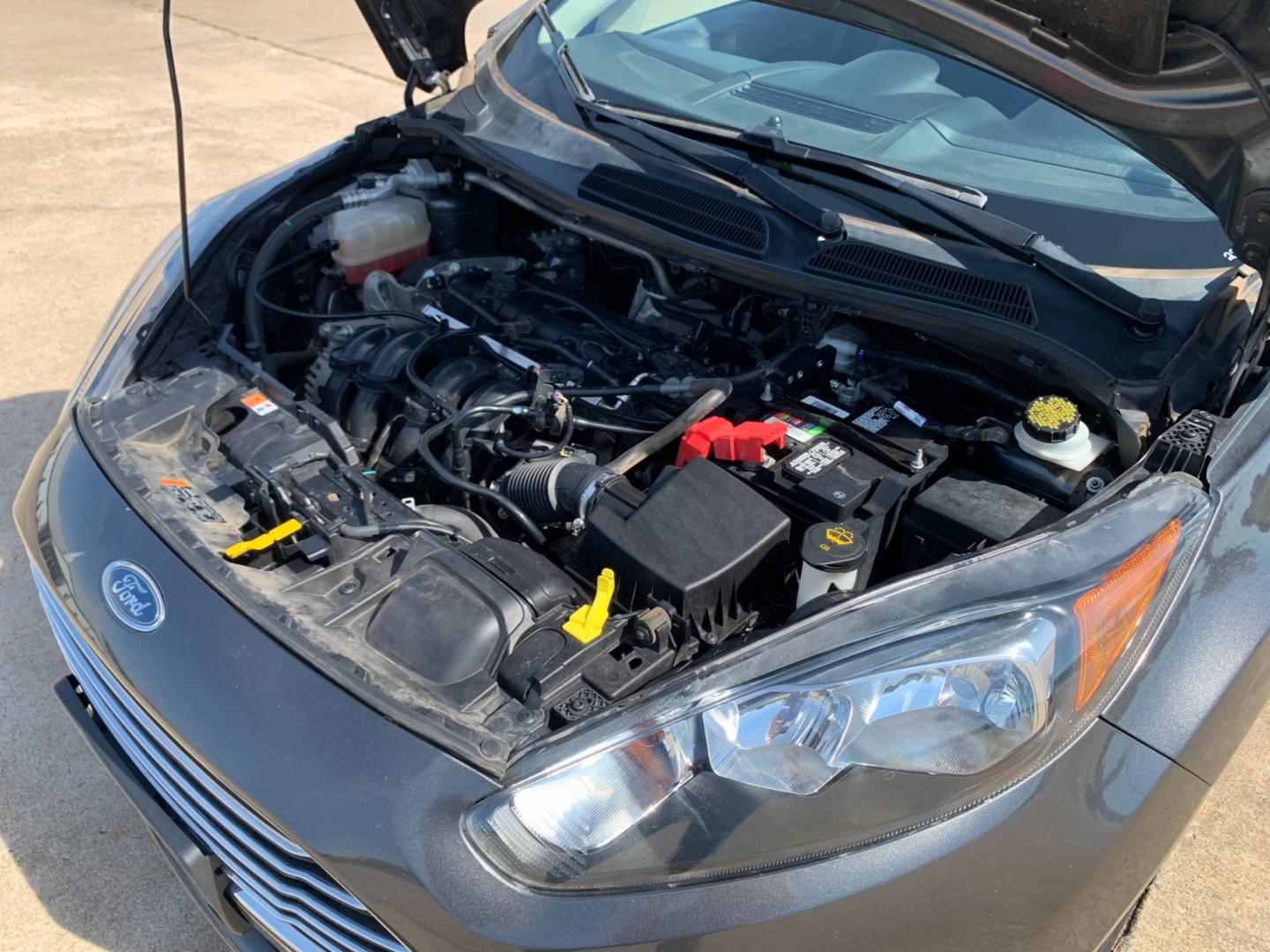 2017 GRAY Ford Fiesta SE Sedan (3FADP4BJXHM) with an 1.6L L4 DOHC 16V engine, located at 17760 Hwy 62, Morris, OK, 74445, (918) 733-4887, 35.609104, -95.877060 - 2017 FORD FIESTA SE 1.6L 4-CYLINDER FWD, RUNS ON GASOLINE, YOU WILL SAVE AT THE GAS PUMP WITH THIS FORD IT GETS 35 MPG. FEATURES A KEYLESS ENTRY REMOTE, POWER LOCKS, POWER WINDOWS, POWER MIRRORS, MANUAL SEATS, AM/FM STEREO, CD PLAYER, BLUETOOTH, CLOTH SEATS, CRUISE CONTROL, HANDS-FREE CALLING, VOICE - Photo#17