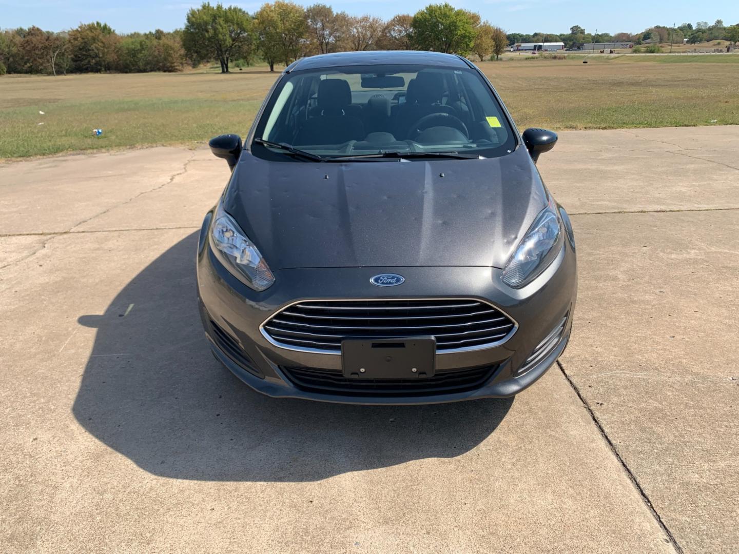 2017 GRAY Ford Fiesta SE Sedan (3FADP4BJXHM) with an 1.6L L4 DOHC 16V engine, located at 17760 Hwy 62, Morris, OK, 74445, (918) 733-4887, 35.609104, -95.877060 - 2017 FORD FIESTA SE 1.6L 4-CYLINDER FWD, RUNS ON GASOLINE, YOU WILL SAVE AT THE GAS PUMP WITH THIS FORD IT GETS 35 MPG. FEATURES A KEYLESS ENTRY REMOTE, POWER LOCKS, POWER WINDOWS, POWER MIRRORS, MANUAL SEATS, AM/FM STEREO, CD PLAYER, BLUETOOTH, CLOTH SEATS, CRUISE CONTROL, HANDS-FREE CALLING, VOICE - Photo#1