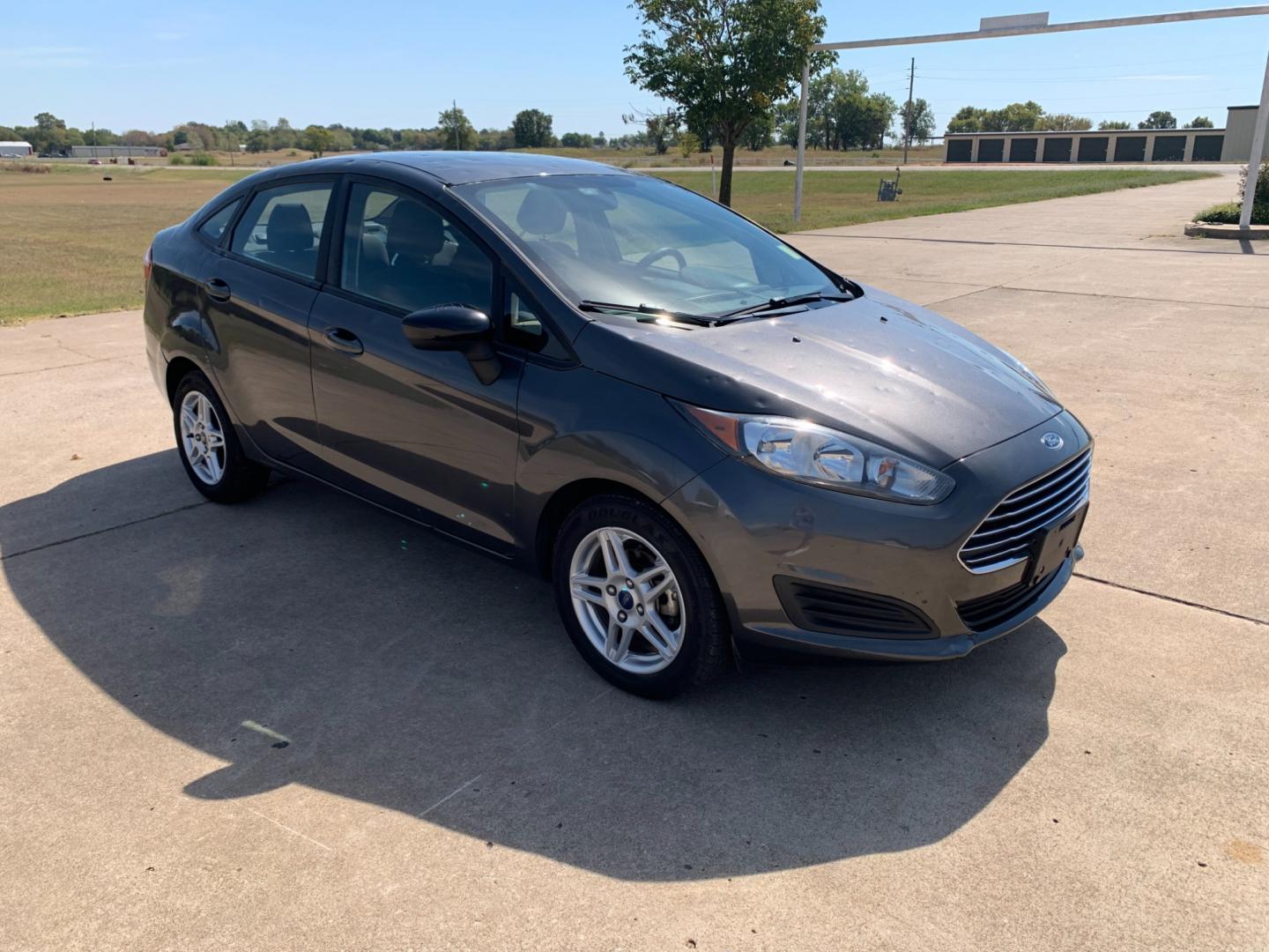 2017 GRAY Ford Fiesta SE Sedan (3FADP4BJXHM) with an 1.6L L4 DOHC 16V engine, located at 17760 Hwy 62, Morris, OK, 74445, (918) 733-4887, 35.609104, -95.877060 - 2017 FORD FIESTA SE 1.6L 4-CYLINDER FWD, RUNS ON GASOLINE, YOU WILL SAVE AT THE GAS PUMP WITH THIS FORD IT GETS 35 MPG. FEATURES A KEYLESS ENTRY REMOTE, POWER LOCKS, POWER WINDOWS, POWER MIRRORS, MANUAL SEATS, AM/FM STEREO, CD PLAYER, BLUETOOTH, CLOTH SEATS, CRUISE CONTROL, HANDS-FREE CALLING, VOICE - Photo#2