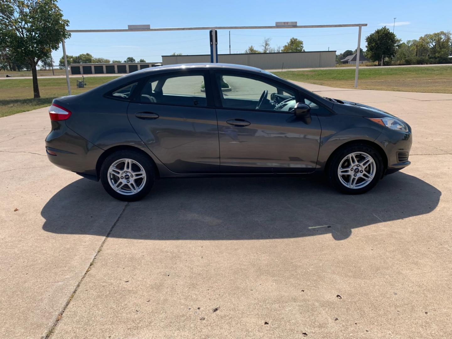 2017 GRAY Ford Fiesta SE Sedan (3FADP4BJXHM) with an 1.6L L4 DOHC 16V engine, located at 17760 Hwy 62, Morris, OK, 74445, (918) 733-4887, 35.609104, -95.877060 - 2017 FORD FIESTA SE 1.6L 4-CYLINDER FWD, RUNS ON GASOLINE, YOU WILL SAVE AT THE GAS PUMP WITH THIS FORD IT GETS 35 MPG. FEATURES A KEYLESS ENTRY REMOTE, POWER LOCKS, POWER WINDOWS, POWER MIRRORS, MANUAL SEATS, AM/FM STEREO, CD PLAYER, BLUETOOTH, CLOTH SEATS, CRUISE CONTROL, HANDS-FREE CALLING, VOICE - Photo#3