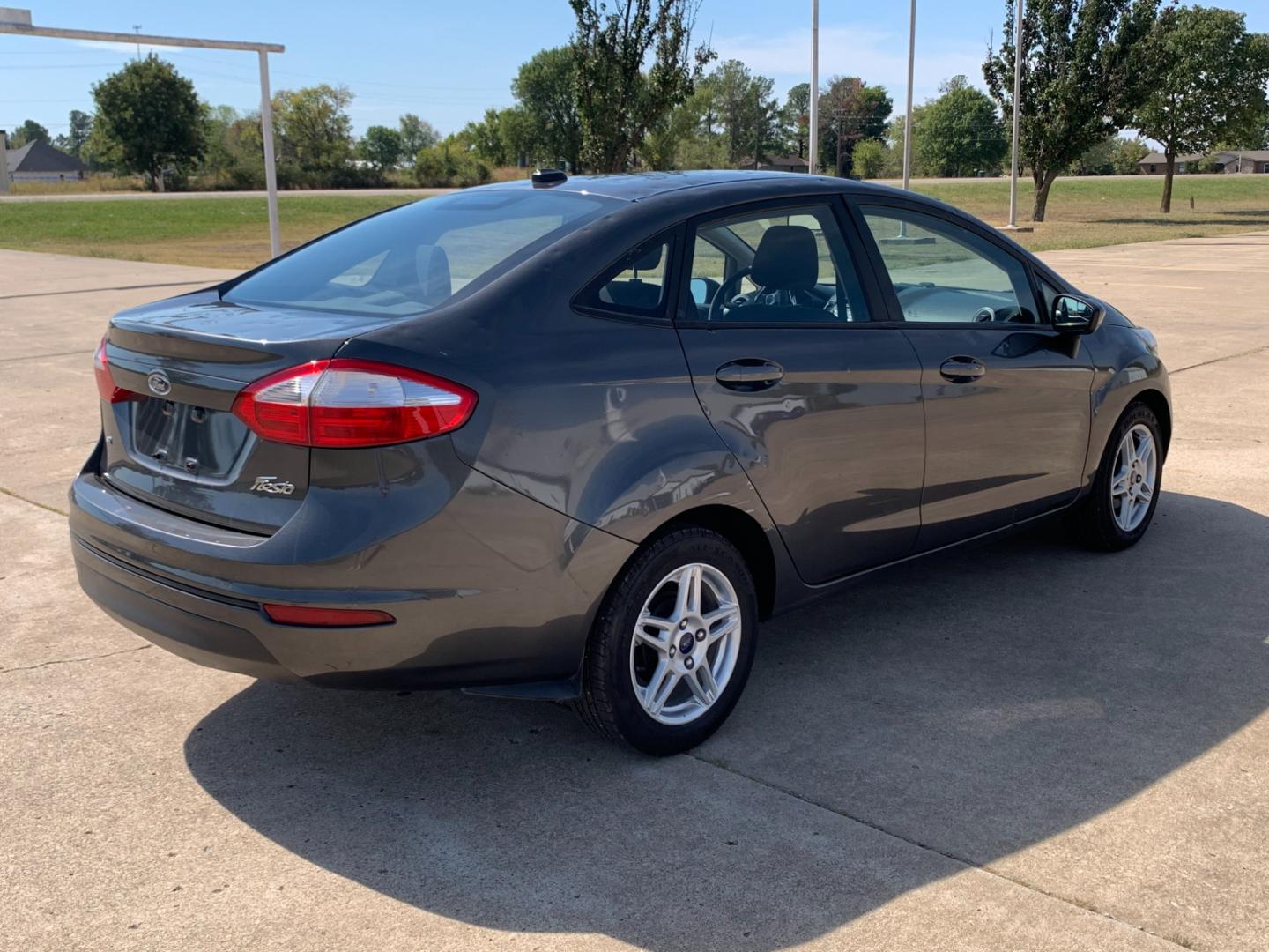 2017 GRAY Ford Fiesta SE Sedan (3FADP4BJXHM) with an 1.6L L4 DOHC 16V engine, located at 17760 Hwy 62, Morris, OK, 74445, (918) 733-4887, 35.609104, -95.877060 - 2017 FORD FIESTA SE 1.6L 4-CYLINDER FWD, RUNS ON GASOLINE, YOU WILL SAVE AT THE GAS PUMP WITH THIS FORD IT GETS 35 MPG. FEATURES A KEYLESS ENTRY REMOTE, POWER LOCKS, POWER WINDOWS, POWER MIRRORS, MANUAL SEATS, AM/FM STEREO, CD PLAYER, BLUETOOTH, CLOTH SEATS, CRUISE CONTROL, HANDS-FREE CALLING, VOICE - Photo#4