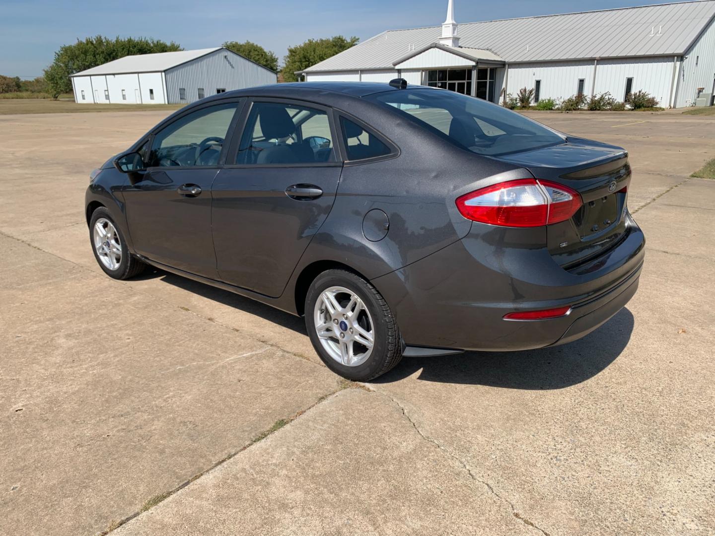 2017 GRAY Ford Fiesta SE Sedan (3FADP4BJXHM) with an 1.6L L4 DOHC 16V engine, located at 17760 Hwy 62, Morris, OK, 74445, (918) 733-4887, 35.609104, -95.877060 - 2017 FORD FIESTA SE 1.6L 4-CYLINDER FWD, RUNS ON GASOLINE, YOU WILL SAVE AT THE GAS PUMP WITH THIS FORD IT GETS 35 MPG. FEATURES A KEYLESS ENTRY REMOTE, POWER LOCKS, POWER WINDOWS, POWER MIRRORS, MANUAL SEATS, AM/FM STEREO, CD PLAYER, BLUETOOTH, CLOTH SEATS, CRUISE CONTROL, HANDS-FREE CALLING, VOICE - Photo#6