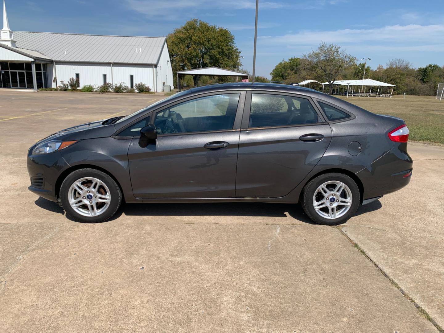 2017 GRAY Ford Fiesta SE Sedan (3FADP4BJXHM) with an 1.6L L4 DOHC 16V engine, located at 17760 Hwy 62, Morris, OK, 74445, (918) 733-4887, 35.609104, -95.877060 - 2017 FORD FIESTA SE 1.6L 4-CYLINDER FWD, RUNS ON GASOLINE, YOU WILL SAVE AT THE GAS PUMP WITH THIS FORD IT GETS 35 MPG. FEATURES A KEYLESS ENTRY REMOTE, POWER LOCKS, POWER WINDOWS, POWER MIRRORS, MANUAL SEATS, AM/FM STEREO, CD PLAYER, BLUETOOTH, CLOTH SEATS, CRUISE CONTROL, HANDS-FREE CALLING, VOICE - Photo#7