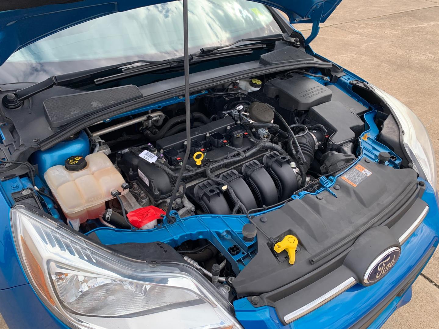 2014 BLUE Ford Focus SE Sedan (1FADP3F25EL) with an 2.0L L4 DOHC 16V engine, AUTOMATIC transmission, located at 17760 Hwy 62, Morris, OK, 74445, (918) 733-4887, 35.609104, -95.877060 - 2014 FORD FOCUS SE HAS A 2.0L 4-CYLINDER FEATURES POWER REMOTE LOCKING SYSTEM, POWER WINDOWS, POWER LOCKS, POWER WINDOWS, POWER MIRRORS, CD PLAYER, AM/FM STEREO, AUX PORT, USB PORT, CLOTH INTERIOR, BLUETOOTH, CRUISE CONTROL, MULTIFUNCTION STEERING WHEEL CONTROL, VOICE COMMAND CONTROL. DOES HAVE REB - Photo#18