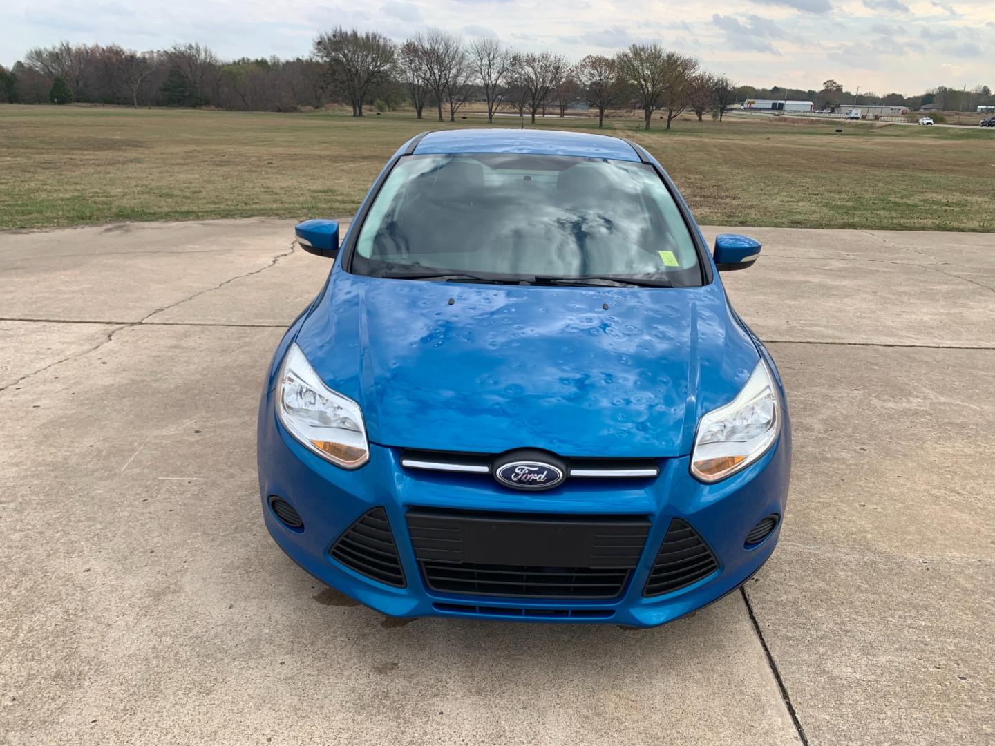 2014 BLUE Ford Focus SE Sedan (1FADP3F25EL) with an 2.0L L4 DOHC 16V engine, AUTOMATIC transmission, located at 17760 Hwy 62, Morris, OK, 74445, (918) 733-4887, 35.609104, -95.877060 - 2014 FORD FOCUS SE HAS A 2.0L 4-CYLINDER FEATURES POWER REMOTE LOCKING SYSTEM, POWER WINDOWS, POWER LOCKS, POWER WINDOWS, POWER MIRRORS, CD PLAYER, AM/FM STEREO, AUX PORT, USB PORT, CLOTH INTERIOR, BLUETOOTH, CRUISE CONTROL, MULTIFUNCTION STEERING WHEEL CONTROL, VOICE COMMAND CONTROL. DOES HAVE REB - Photo#1