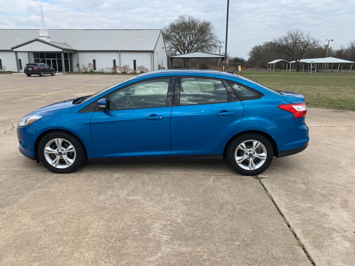 2014 BLUE Ford Focus SE Sedan (1FADP3F25EL) with an 2.0L L4 DOHC 16V engine, AUTOMATIC transmission, located at 17760 Hwy 62, Morris, OK, 74445, (918) 733-4887, 35.609104, -95.877060 - 2014 FORD FOCUS SE HAS A 2.0L 4-CYLINDER FEATURES POWER REMOTE LOCKING SYSTEM, POWER WINDOWS, POWER LOCKS, POWER WINDOWS, POWER MIRRORS, CD PLAYER, AM/FM STEREO, AUX PORT, USB PORT, CLOTH INTERIOR, BLUETOOTH, CRUISE CONTROL, MULTIFUNCTION STEERING WHEEL CONTROL, VOICE COMMAND CONTROL. DOES HAVE REB - Photo#7