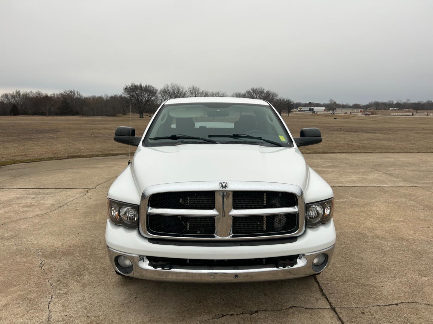 2004 White Dodge Ram 2500 Laramie Quad Cab 2WD (3D7KA28C94G) with an 5.9L L6 OHV 24V TURBO DIESEL engine, located at 17760 Hwy 62, Morris, OK, 74445, (918) 733-4887, 35.609104, -95.877060 - Photo#1