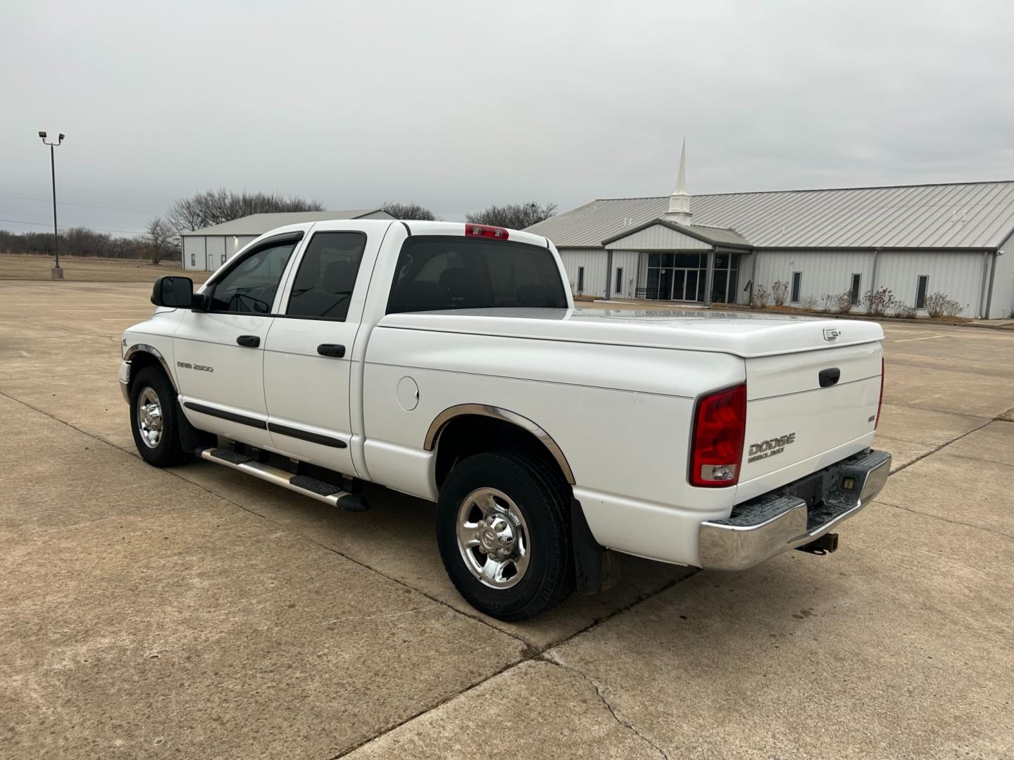 2004 White Dodge Ram 2500 Laramie Quad Cab 2WD (3D7KA28C94G) with an 5.9L L6 OHV 24V TURBO DIESEL engine, located at 17760 Hwy 62, Morris, OK, 74445, (918) 733-4887, 35.609104, -95.877060 - Photo#6