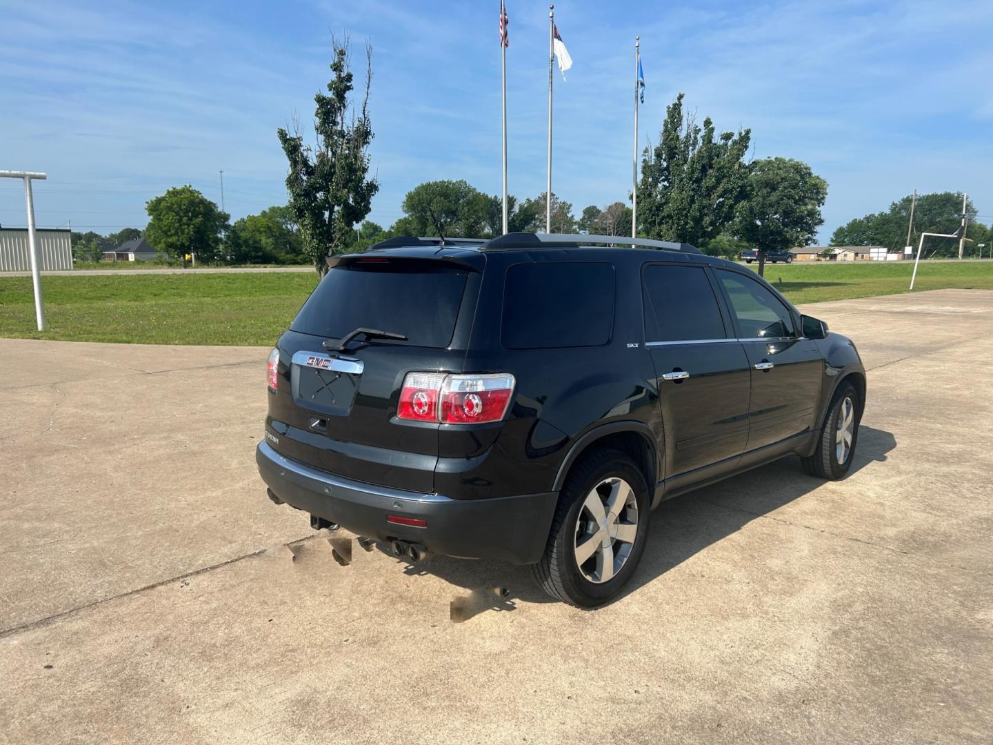 2012 BLACK GMC Acadia SLT-1 FWD (1GKKRRED3CJ) with an 3.6L V6 DOHC 24V engine, 6-Speed Automatic transmission, located at 17760 Hwy 62, Morris, OK, 74445, (918) 733-4887, 35.609104, -95.877060 - 2012 GMC ACADIA SLT-1 FWD FEATURES POWER WINDOWS, POWER LOCKS, POWER SEATS, POWER MIRRORS, CD PLAYER, AUXILLARY PORT, AM/FM STEREO, HEATED SEATS, CRUISE CONTROL, TRACTION CONTROL, BACKUP CAMERA. CLEAN TITLE WITH 136,854 MILES. MICHELIN 255/60R16 TIRES. *******DOES HAVE SCRATCHES AS SHOWN IN PICTURES - Photo#4