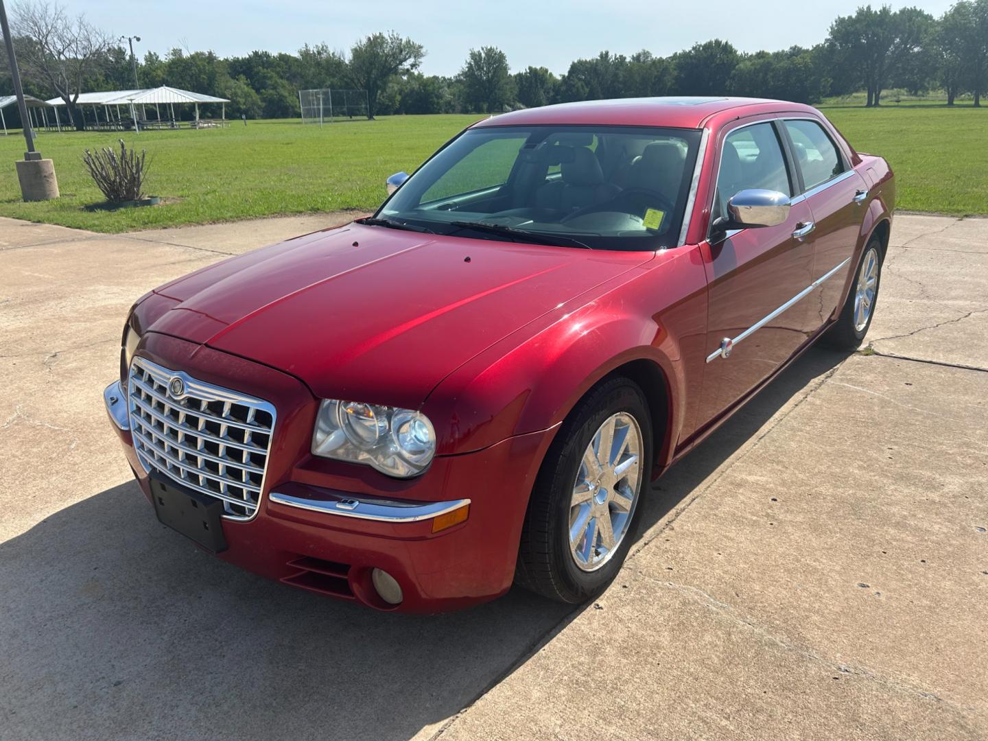 2006 RED Chrysler 300 C (2C3LA63H76H) with an 5.7L V8 OHV 16V engine, 5-Speed Automatic Overdrive transmission, located at 17760 Hwy 62, Morris, OK, 74445, (918) 733-4887, 35.609104, -95.877060 - 2006 CHRYSLER 300 C FEATURES POWER SEATS, POWER WINDOWS, POWER LOCKS, POWER MIRRORS, AM/FM STEREO, CD PLAYER, CASSETTE PLAYER, DUAL CLIMATE CONTROL, HEATED SEATS, SUNROOF, LEATHER SEATS. 152,338 MILES WITH 225/60R18 TIRES. ******DOES HAVE A REBUILT TITLE******** $6900 CALL RUSS OR JONA AT 91 - Photo#0