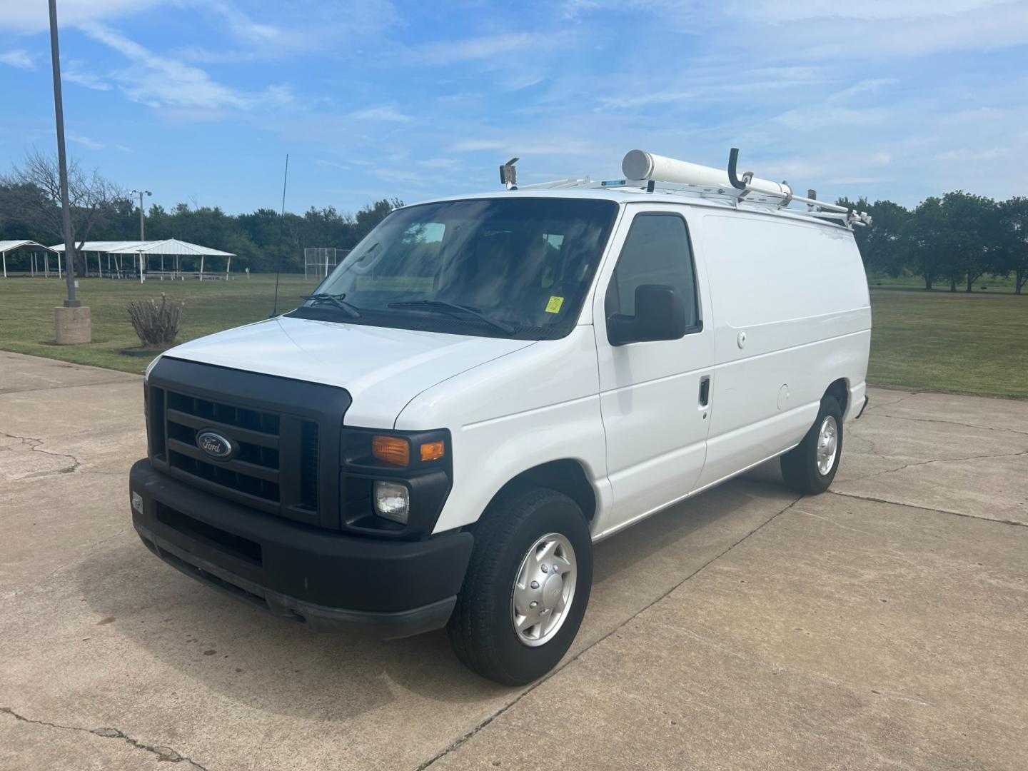 2010 White Ford E-Series Van E-250 (1FTNE2ELXAD) with an 5.4L V8 SOHC 16V engine, 4-Speed Automatic transmission, located at 17760 Hwy 62, Morris, OK, 74445, (918) 733-4887, 35.609104, -95.877060 - Photo#0