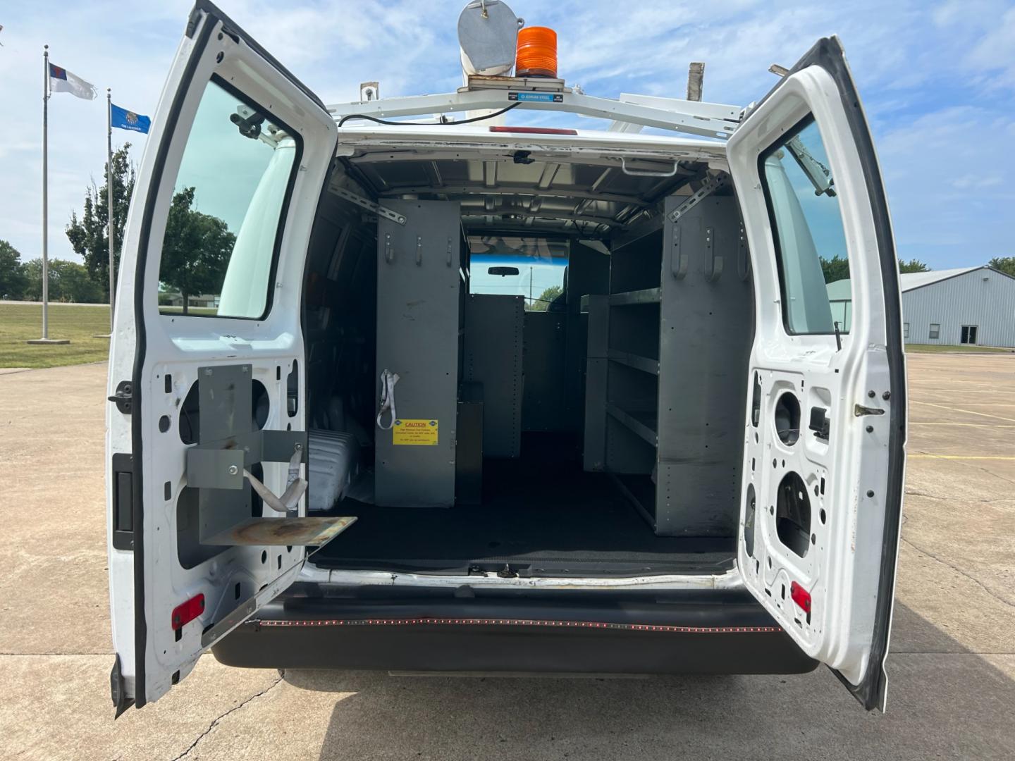 2010 White Ford E-Series Van E-250 (1FTNE2ELXAD) with an 5.4L V8 SOHC 16V engine, 4-Speed Automatic transmission, located at 17760 Hwy 62, Morris, OK, 74445, (918) 733-4887, 35.609104, -95.877060 - Photo#13