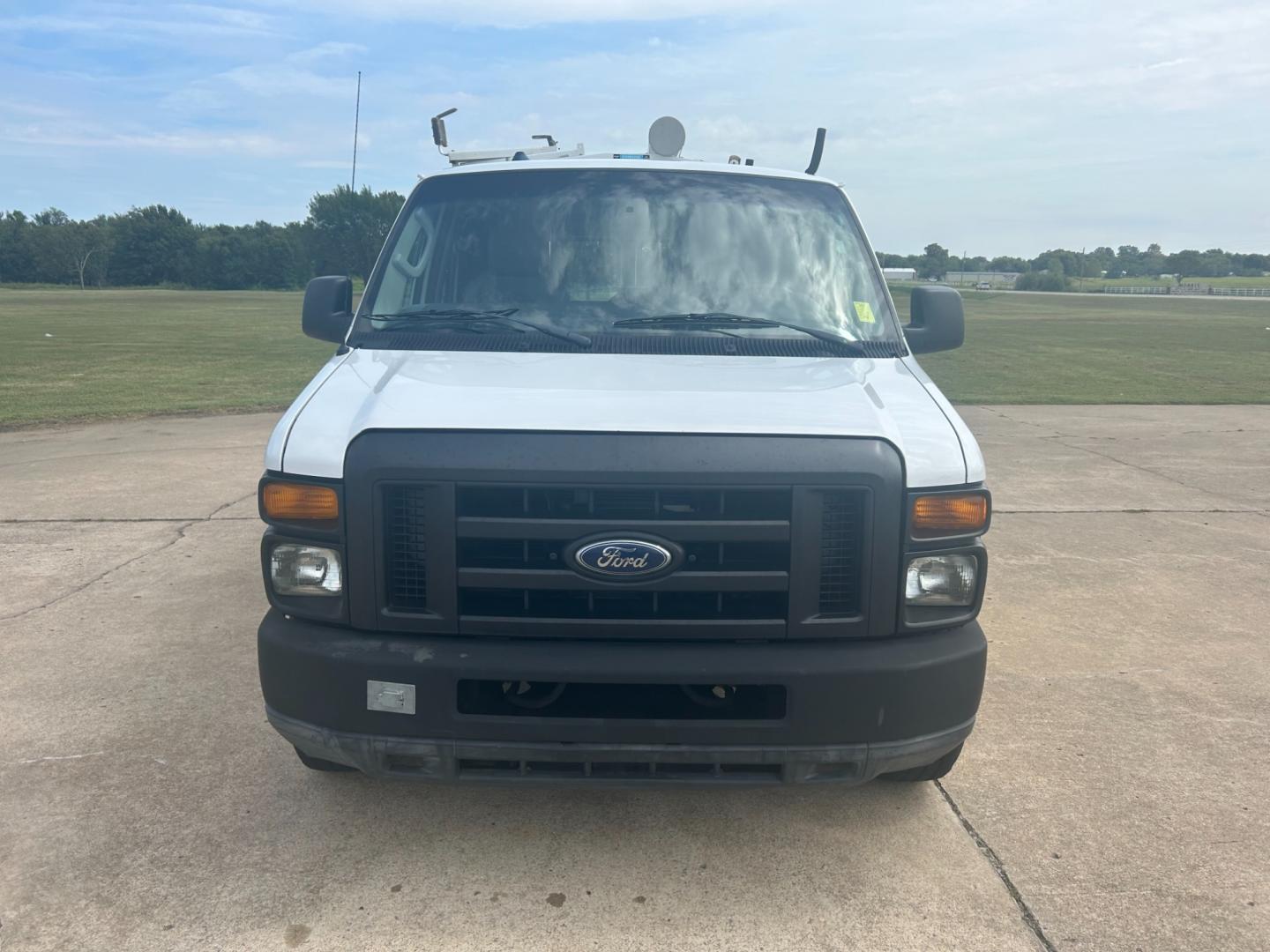 2010 White Ford E-Series Van E-250 (1FTNE2ELXAD) with an 5.4L V8 SOHC 16V engine, 4-Speed Automatic transmission, located at 17760 Hwy 62, Morris, OK, 74445, (918) 733-4887, 35.609104, -95.877060 - Photo#1