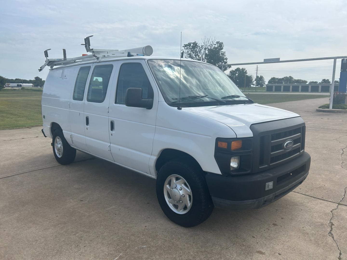 2010 White Ford E-Series Van E-250 (1FTNE2ELXAD) with an 5.4L V8 SOHC 16V engine, 4-Speed Automatic transmission, located at 17760 Hwy 62, Morris, OK, 74445, (918) 733-4887, 35.609104, -95.877060 - Photo#2