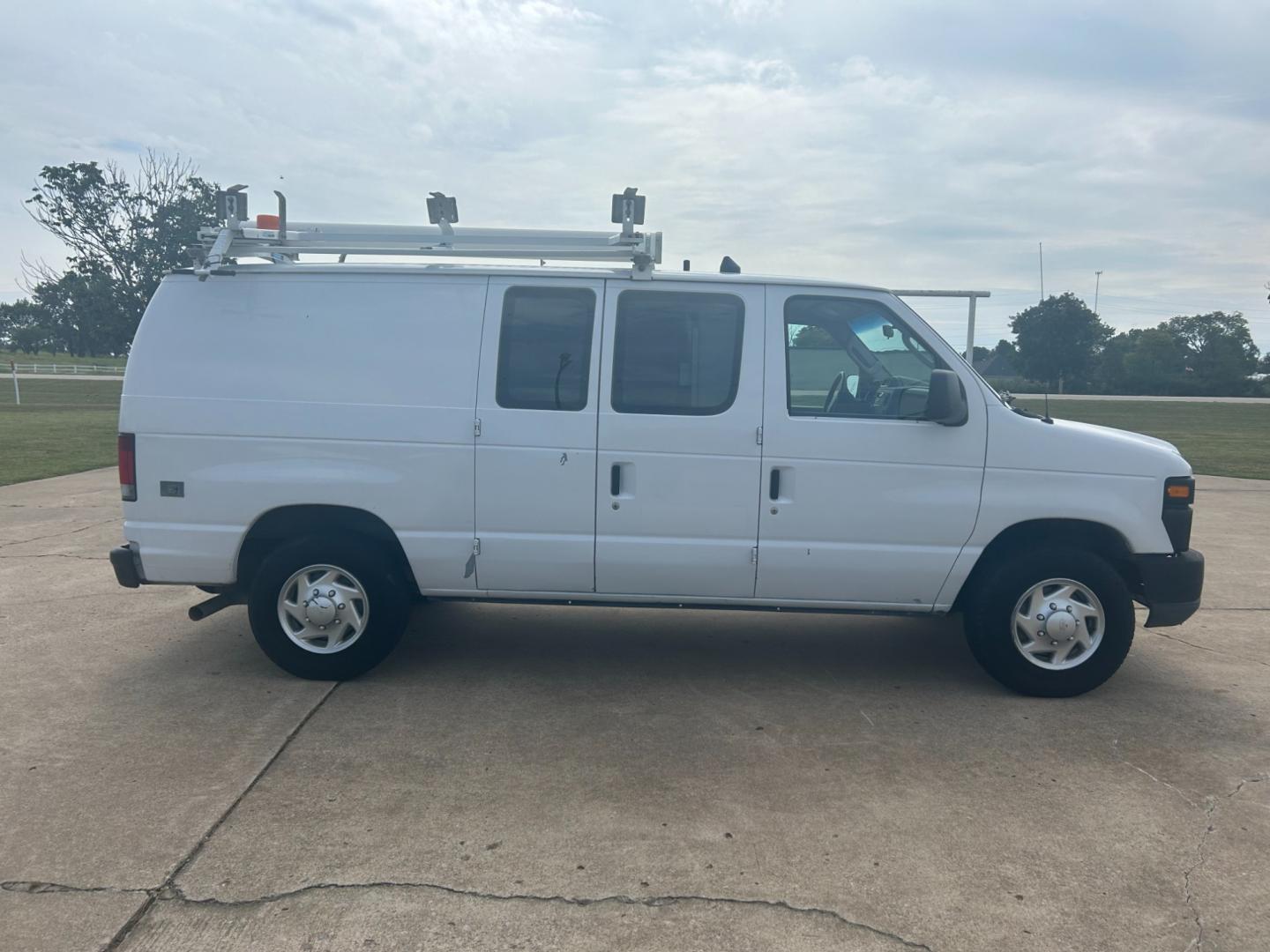 2010 White Ford E-Series Van E-250 (1FTNE2ELXAD) with an 5.4L V8 SOHC 16V engine, 4-Speed Automatic transmission, located at 17760 Hwy 62, Morris, OK, 74445, (918) 733-4887, 35.609104, -95.877060 - Photo#3