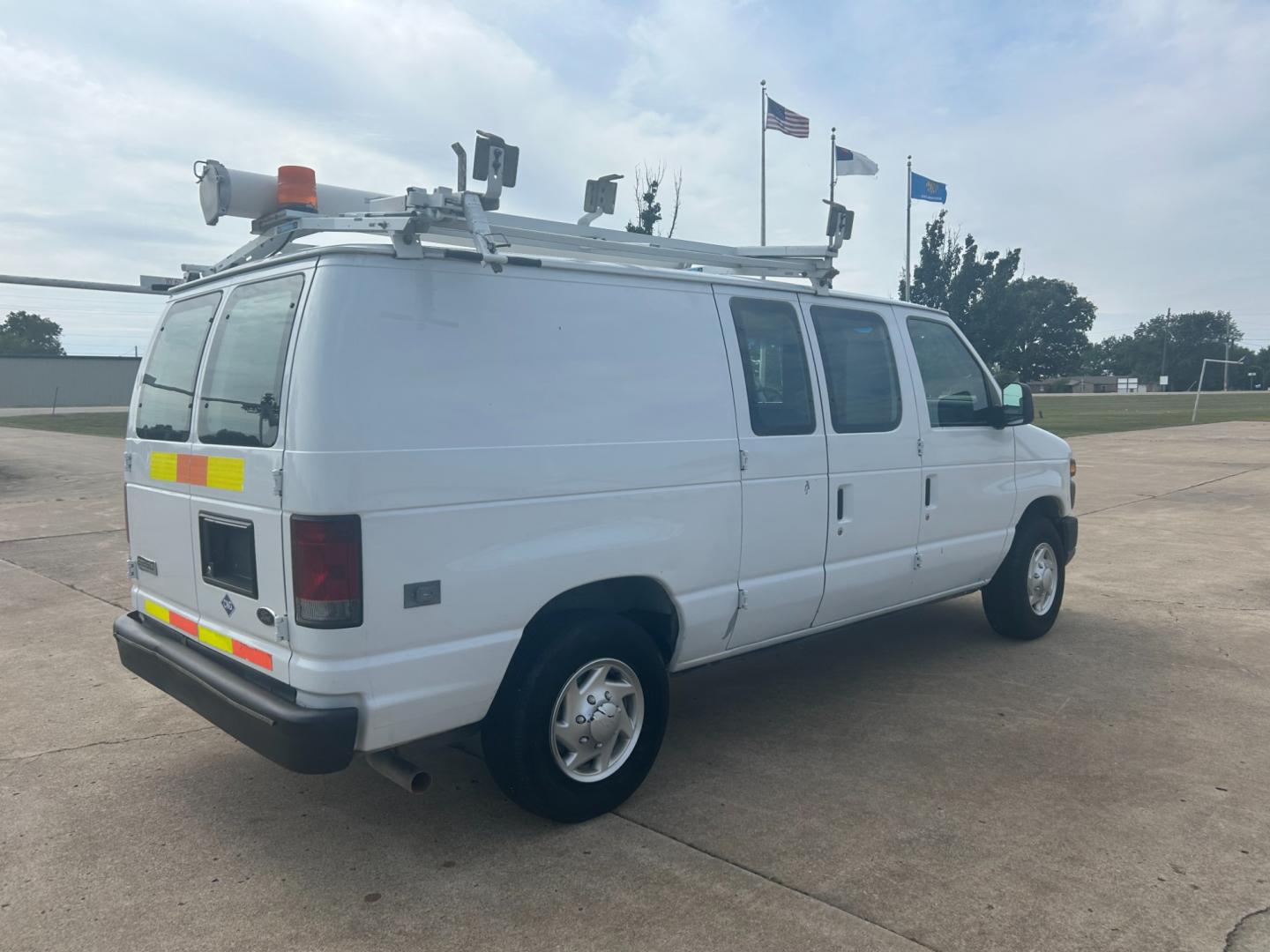 2010 White Ford E-Series Van E-250 (1FTNE2ELXAD) with an 5.4L V8 SOHC 16V engine, 4-Speed Automatic transmission, located at 17760 Hwy 62, Morris, OK, 74445, (918) 733-4887, 35.609104, -95.877060 - Photo#4