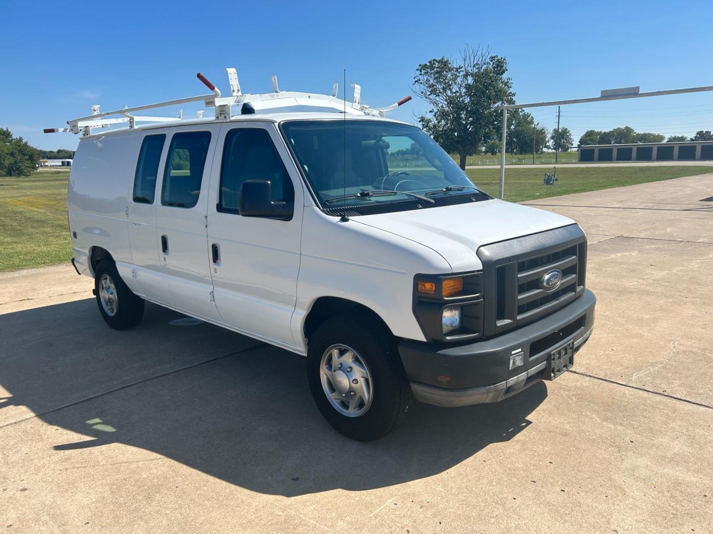 2010 White Ford E-Series Van E-250 (1FTNE2EL9AD) with an 5.4L V8 SOHC 16V engine, 4-Speed Automatic transmission, located at 17760 Hwy 62, Morris, OK, 74445, (918) 733-4887, 35.609104, -95.877060 - Photo#2