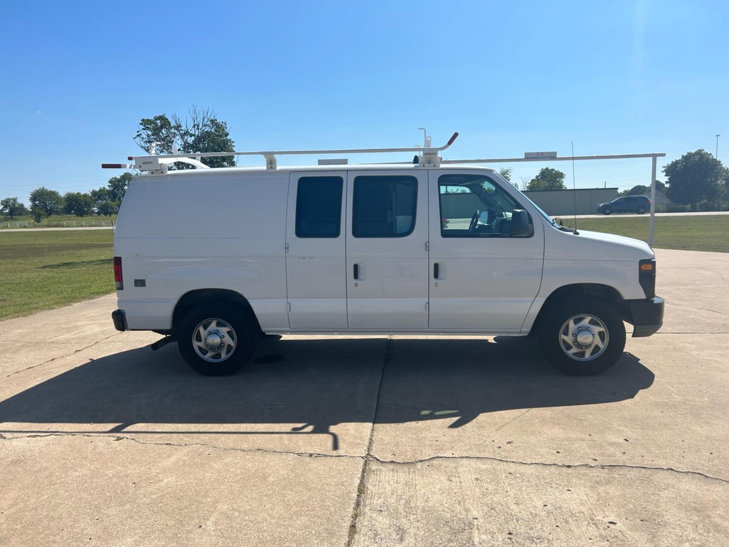 2010 White Ford E-Series Van E-250 (1FTNE2EL9AD) with an 5.4L V8 SOHC 16V engine, 4-Speed Automatic transmission, located at 17760 Hwy 62, Morris, OK, 74445, (918) 733-4887, 35.609104, -95.877060 - Photo#3