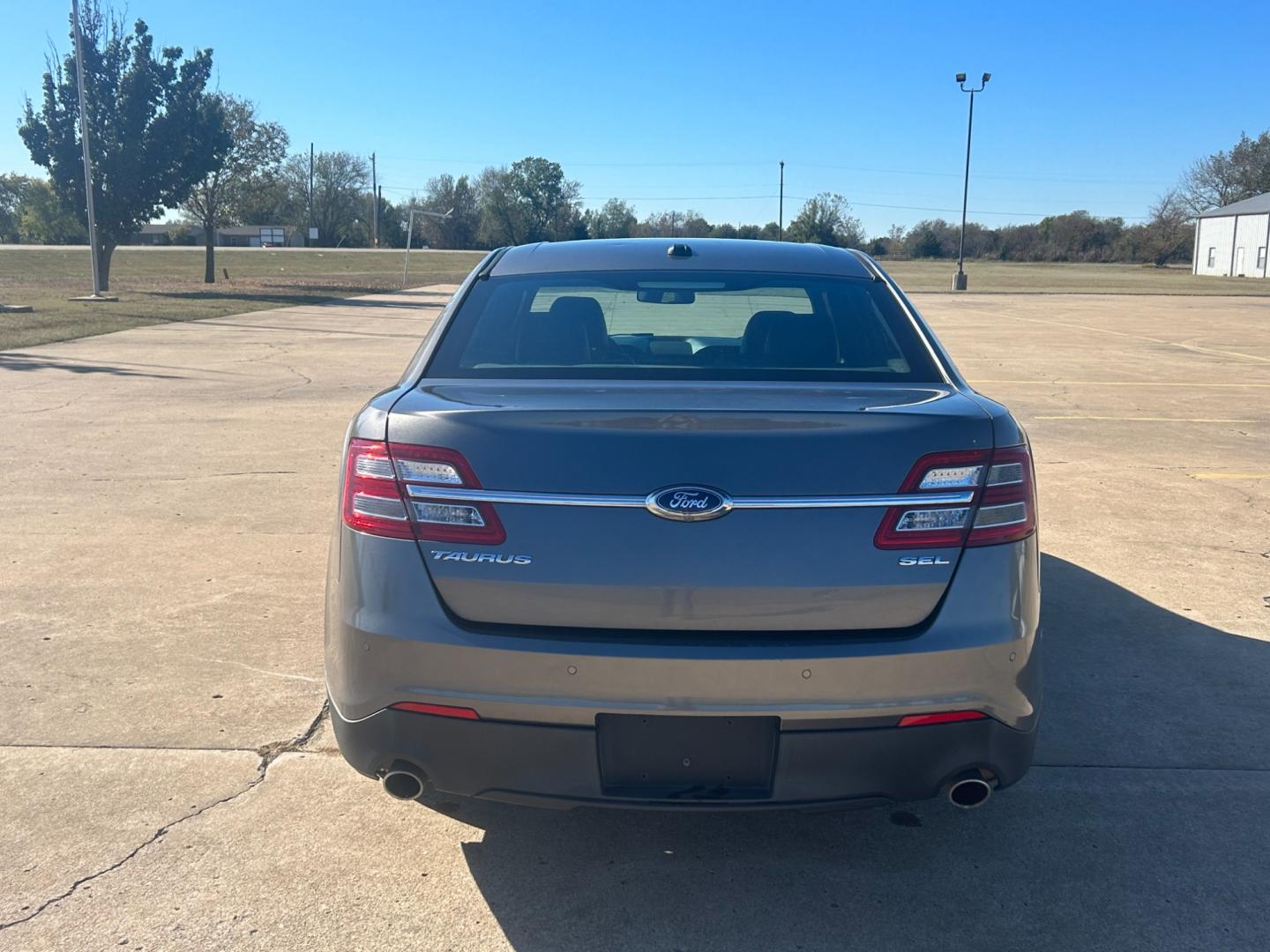 2014 GRAY Ford Taurus SEL FWD (1FAHP2E81EG) with an 3.5L V6 DOHC 24V engine, 6-Speed Automatic transmission, located at 17760 Hwy 62, Morris, OK, 74445, (918) 733-4887, 35.609104, -95.877060 - Photo#6