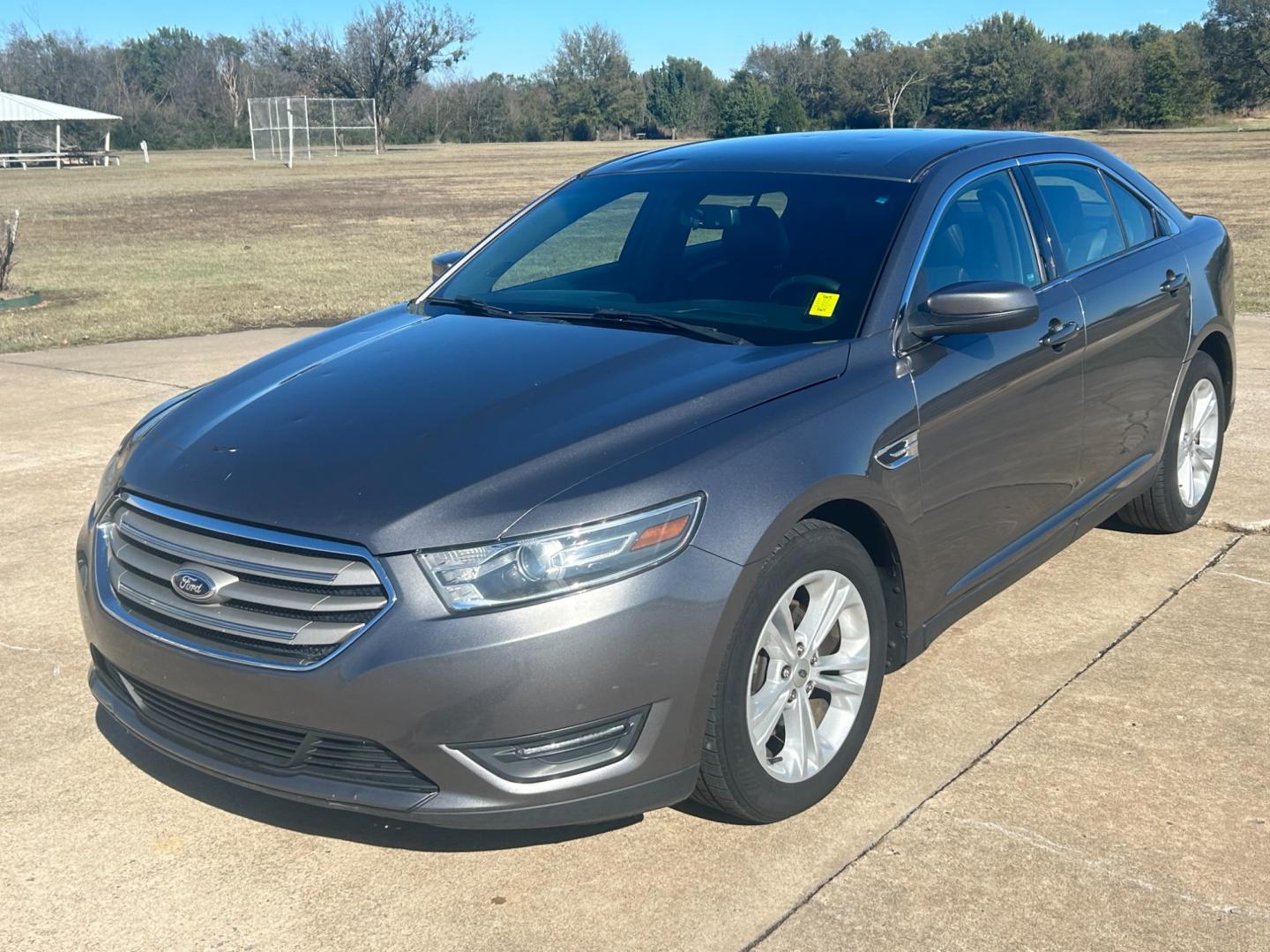 2014 GRAY Ford Taurus SEL FWD (1FAHP2E81EG) with an 3.5L V6 DOHC 24V engine, 6-Speed Automatic transmission, located at 17760 Hwy 62, Morris, OK, 74445, (918) 733-4887, 35.609104, -95.877060 - Photo#0