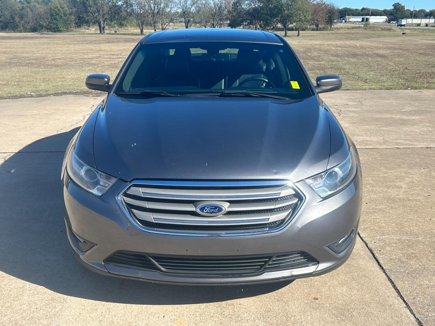 2014 GRAY Ford Taurus SEL FWD (1FAHP2E81EG) with an 3.5L V6 DOHC 24V engine, 6-Speed Automatic transmission, located at 17760 Hwy 62, Morris, OK, 74445, (918) 733-4887, 35.609104, -95.877060 - Photo#1