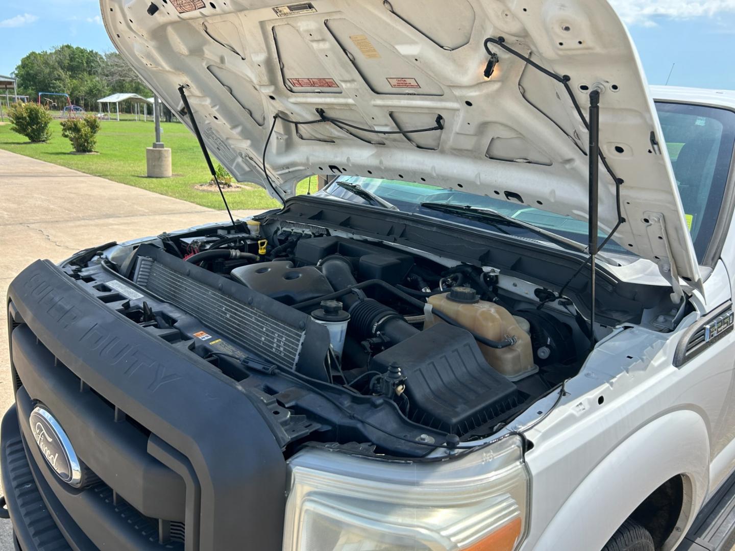 2012 White /Gray Ford F-250 SD SUPER DUTY (1FT7X2A66CE) with an 6.2L V8 OHV 16V engine, AUTOMATIC transmission, located at 17760 Hwy 62, Morris, OK, 74445, (918) 733-4887, 35.609104, -95.877060 - 2012 FORD F250 SUPERCAB HAS THE 6.2L V8 ENGINE AND IS 2WD IT IS DEDICATED CNG (COMPRESSED NATURAL GAS) FEATURES MANUAL SEATS, POWER LOCKS, POWER WINDOWS, POWER MIRRORS, AM/FM STEREO, TILT WHEEL, CLOTH INTERIOR,CRUISE CONTROL, TRACTION CONTROL, TOOL BED WITH STORAGE, BED LINER, AND FIRESTONE TIRES 2 - Photo#20