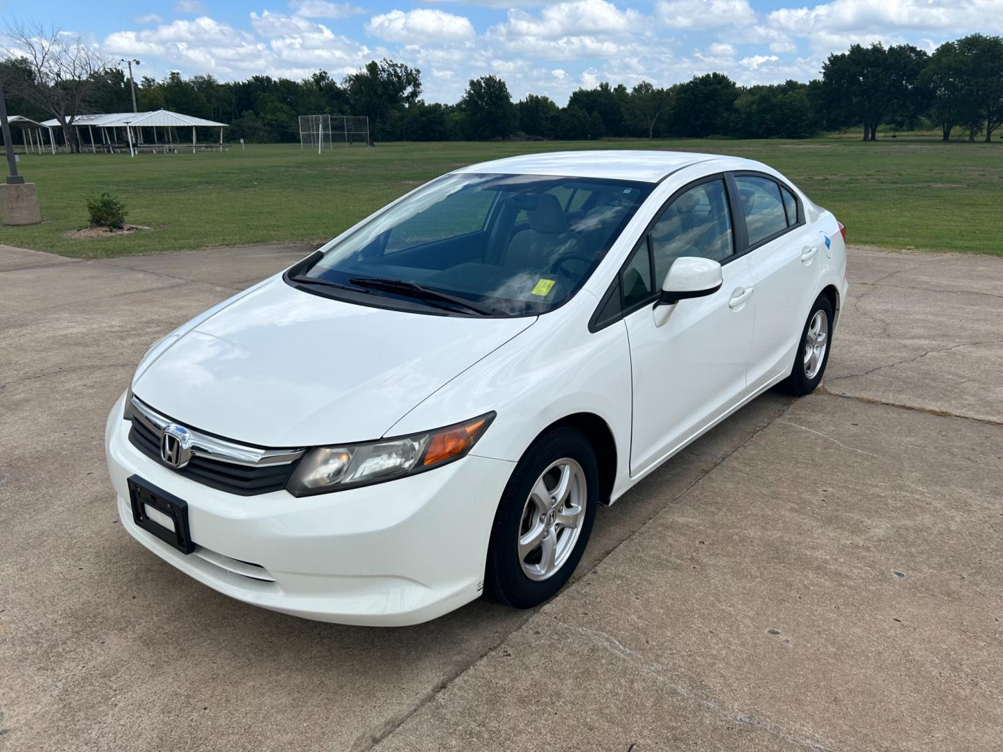 2012 White /Gray Honda Civic CNG Sedan 5-Speed AT (19XFB5F58CE) with an 1.8L L4 SOHC 16V CNG engine, 5-Speed Automatic transmission, located at 17760 Hwy 62, Morris, OK, 74445, (918) 733-4887, 35.609104, -95.877060 - 2012 HONDA CIVIC DEDICATED CNG (COMPRESSED NATURAL GAS) HAS A 1.8L 4 CYLINDER ENGINE AND IS 2WD FEATURES KEYLESS ENTRY, MANUAL SEATS, CLOTH INTERIOR, AM/FM RADIO WITH CD PLAYER, AUXILIARY PORT, USB PORT, POWER WINDOWS, POWER LOCKS, POWER MIRROR, MULTI FUNCTION STEERING WHEEL, HAND FREE CALLING, CRUI - Photo#0