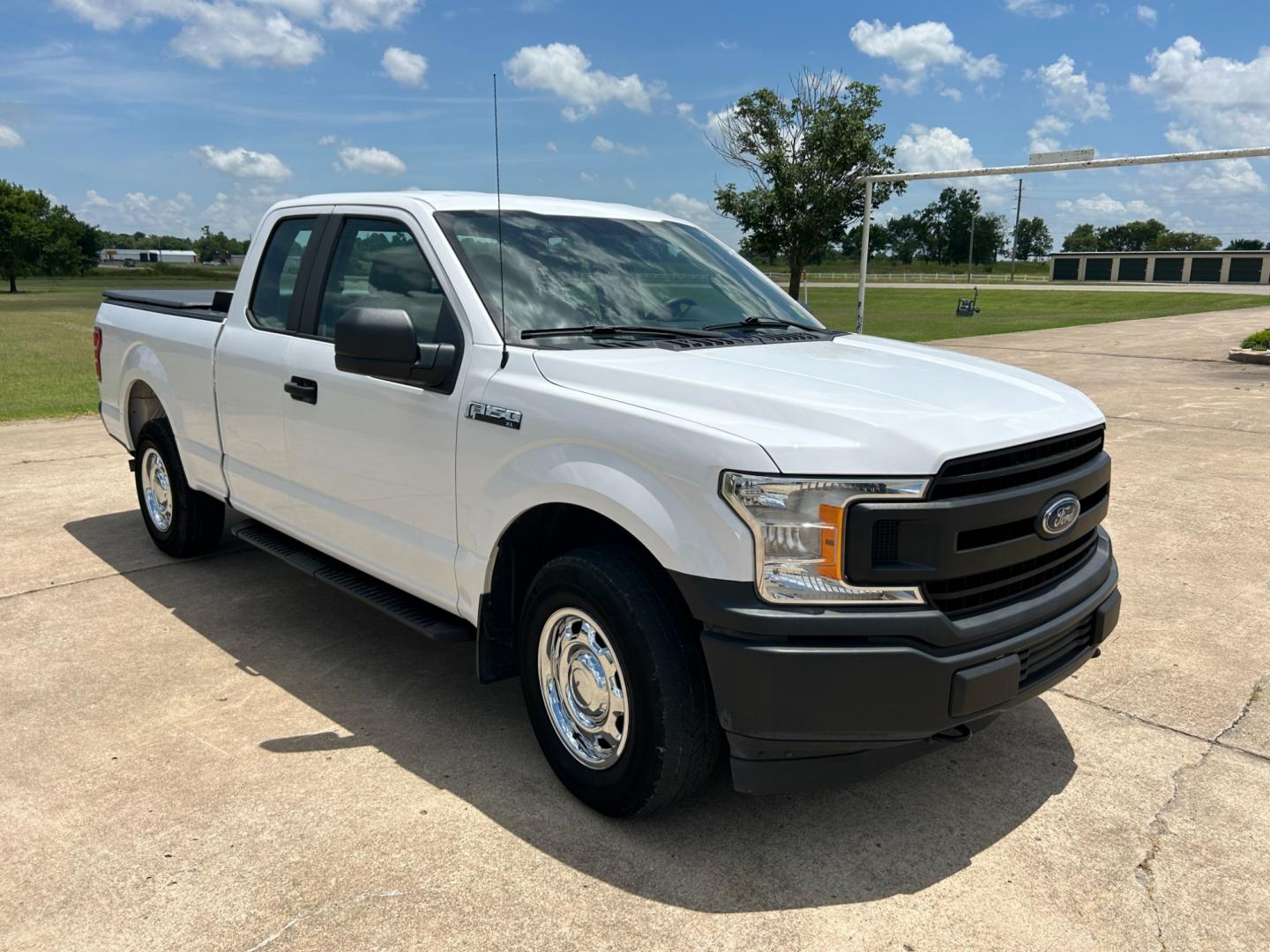 2018 White /Gray Ford F-150 EXTENDED CAB (1FTFX1E52JK) with an 5.0L V8 OHV 16V engine, 10 SPEED AUTOMATIC transmission, located at 17760 Hwy 62, Morris, OK, 74445, (918) 733-4887, 35.609104, -95.877060 - 2018 FORD F150 HAS A 5.0L V8 ENGINE AND IS 4WD. FEATURES KEYLESS ENTERY, LEATHER INTERIOR, POWER WINDOWS, POWER LOCKS, POWER MIRRORS, AM/FM RADIO, A/C, TRACTION CONTROL, AUXILIARY PORT, BACKUP CAMERA, TILT STEERING WHEEL, BED COVER, AND BED LINER. EQUIPPED WITH A BI-FUEL CNG FUEL SYSTEM. IT RUNS ON - Photo#2