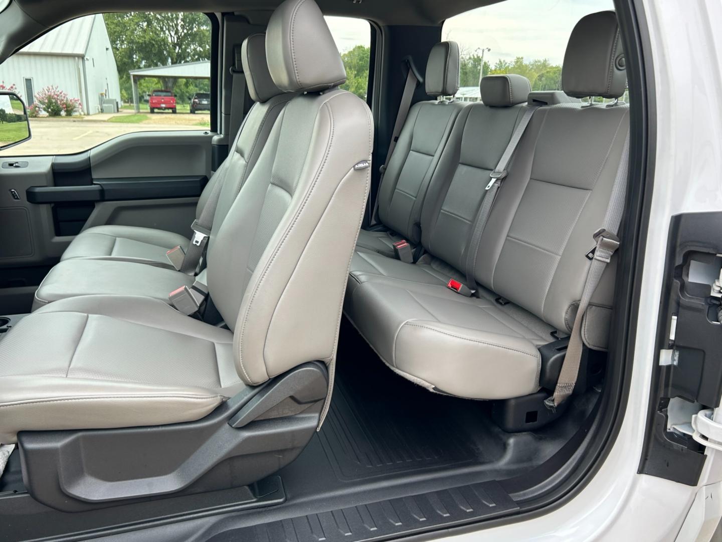 2018 White /Gray Ford F-150 XL SuperCab 6.5-ft. Bed 4WD (1FTFX1E57JK) with an 5.0L V8 OHV 16V engine, AUTOMATIC transmission, located at 17760 Hwy 62, Morris, OK, 74445, (918) 733-4887, 35.609104, -95.877060 - 2018 FORD F150 HAS A 5.0L V8 ENGINE AND IS 4WD. FEATURES KEYLESS ENTERY, LEATHER INTERIOR, POWER WINDOWS, POWER LOCKS, POWER MIRRORS, AM/FM RADIO, A/C, TRACTION CONTROL, AUXILIARY PORT, BACKUP CAMERA, TILT STEERING WHEEL, BED COVER, AND BED LINER. EQUIPPED WITH A BI-FUEL CNG FUEL SYSTEM. IT RUNS ON - Photo#15