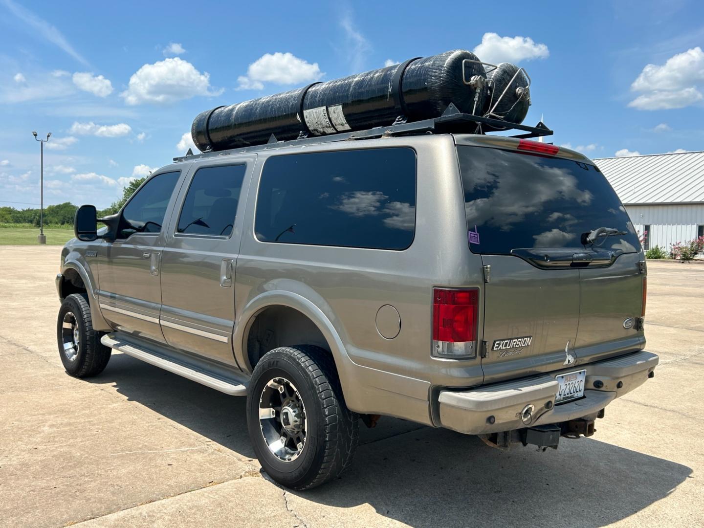 2002 GRAY /TAN Ford Excursion LIMITED (1FMNU43S32E) with an 6.8L V10 engine, AUTOMATIC transmission, located at 17760 Hwy 62, Morris, OK, 74445, (918) 733-4887, 35.609104, -95.877060 - 2002 FORD EXCURSION BI-FUEL SYSTEM (RUNS ON CNG OR GASOLINE) HAS THE 6.8L V10 ENGINE AND IS 4WD. IT FEATURES POWER SEATS, POWER LOCKS, POWER WINDOWS, POWER MIRROR, LEATHER INTERIOR, 3RD ROW SEATING, TILT WHEEL, ADJUSTABLE FOOT PEDAL, AM/FM RADIO AND CD PLAYER, A/C AND HAS REAR A/C. MILES 209,025 ** - Photo#6