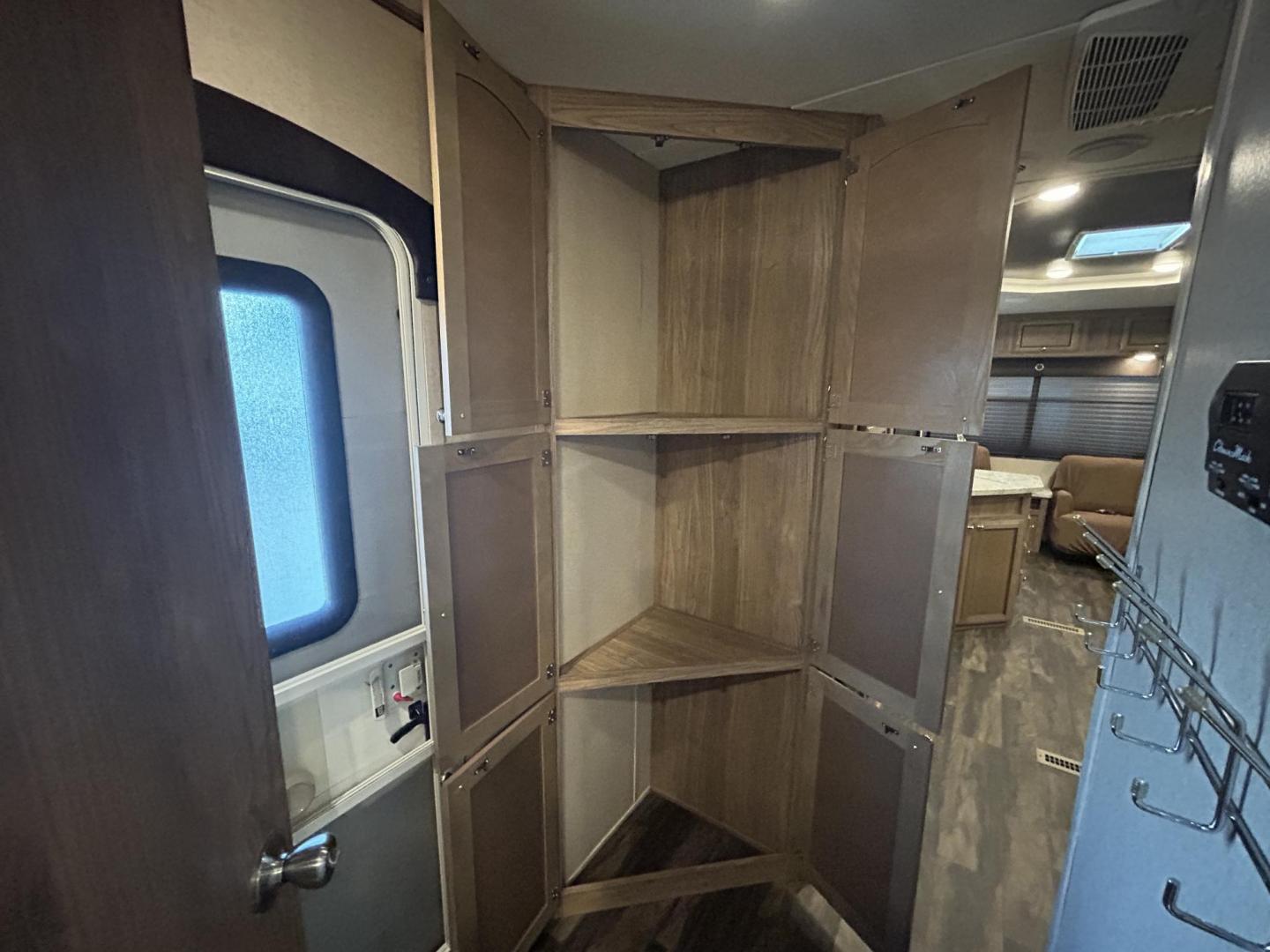 2018 /TAN Forest River Shasta Revere 27RL (5ZT2SHSB3JE) , located at 17760 Hwy 62, Morris, OK, 74445, 35.609104, -95.877060 - WE HAVE THE PERFECT CAMPER FOR YOU AND YOUR FAMILY A 2018 SHASTA REVERE 34FT. HAS A 17FT POWER AWNING. IN THE FRONT OF THE CAMPER YOU HAVE A QUEEN SIZED BED WITH STORAGE UNDERNEATH, OVERHEAD STORAGE, WARDROBE CLOSETS, CONNECTED TO THE BEDROOM IS THE BATHROOM WITH A STAND UP SHOWER, VANITY WITH MEDIC - Photo#18