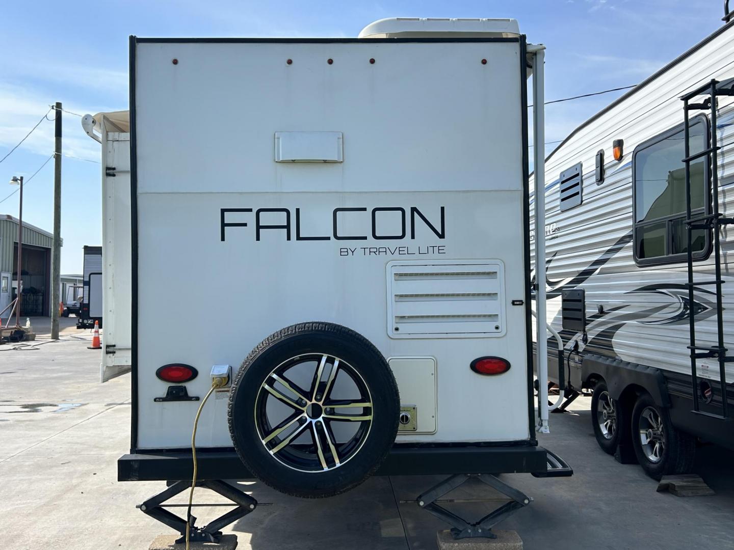 2018 White Travel Lite, Inc Unknown F22RK (55MT1KL17JP) , located at 17760 Hwy 62, Morris, OK, 74445, 35.609104, -95.877060 - WE HAVE THE PERFECT CAMPER FOR A GETAWAY TRIP. ITS A 2018 TRAVEL LITE FALCON 21FT. IT FEATURES A BOOTH STYLE DINETTE DROPS DOWN FOR ADDITIONAL SLEEPING AND STORAGE UNDERNEATH, QUEEN SIZED BED, SHIRT CLOSET, AM/FM RADIO WITH DVD PLAYER, 2 BURNER STOVE WITH STORAGE, (NO OVEN), OVERHEAD MICROWAVE, MID- - Photo#7