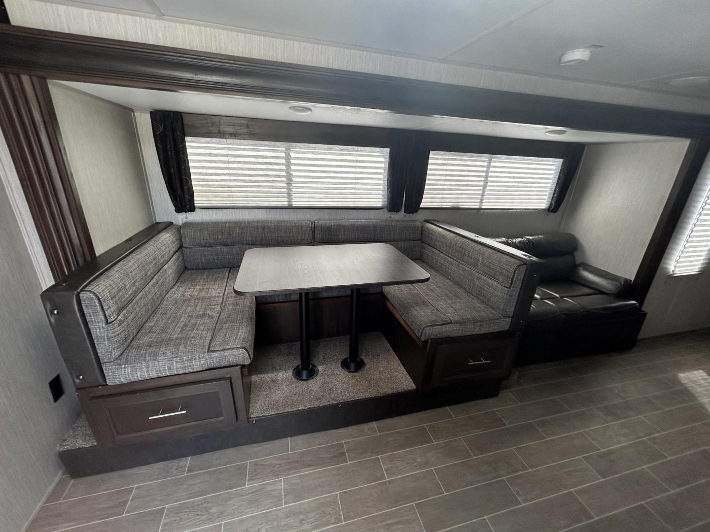 2020 GRAY /Gray Forest River PATRIOT 29TE (4X4TCKE28LX) , located at 17760 Hwy 62, Morris, OK, 74445, 35.609104, -95.877060 - HERE IS THE PERFECT FAMILY CAMPER FOR YOU AND YOUR FAMILY. A 2020 FOREST RIVER PATRIOT 36.5FT. IT FEATURES,1 SLIDE OUT, POWER ANWING 15FT, POWER STABILIZERS JACKS, 2 OUTSIDE STORAGE, OUTSIDE KITCHEN WITH A 2 BURNER STOVE, MINI FRIDGE, SINK WITH OVERHEAD STORAGE, HAS ICE MAKER, LEASH LATCH FOR ANIMAL - Photo#21