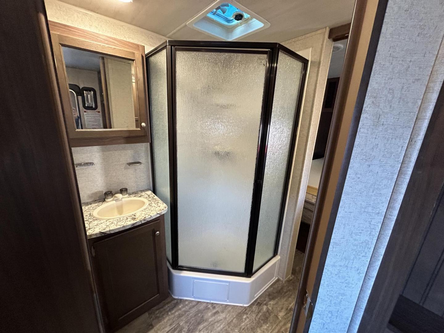 2017 White /TAN HEARTLAND TRAIL RUNNER TOY HAULER 26TH (5SFEB3027HE) , located at 17760 Hwy 62, Morris, OK, 74445, 35.609104, -95.877060 - WE HAVE THE PERFECT CAMPER FOR YOU TO CAMP AND HAUL YOUR TOYS IN. THIS IS A 2017 HEARTLAND TRAIL RUNNER OVERALL 30FT. IT FEATURES 17FT POWER AWNING, POWER JACK STABILIZERS, AMFM BLUETOOTH RADIO. IN THE FRONT YOU HAVE A QUEEN SIZED BED WITH STORAGE UNDERNEATH, OVERHEAD STORAGE, 2 WARDROBE CLOSETS, CO - Photo#21