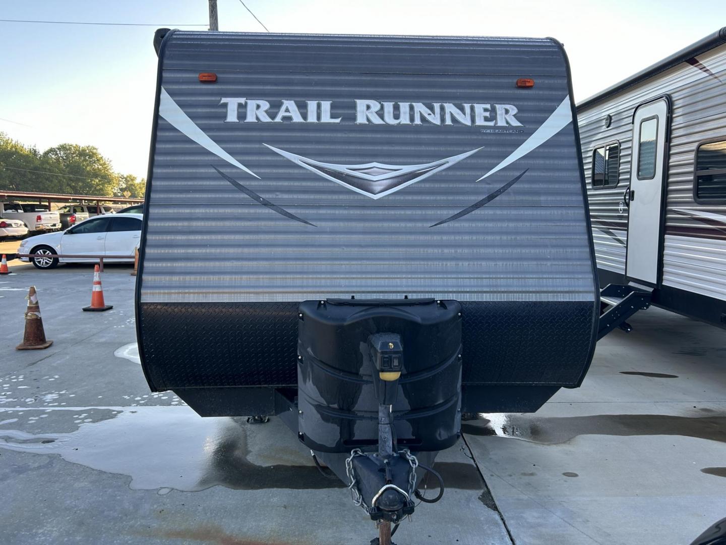 2017 White /TAN HEARTLAND TRAIL RUNNER TOY HAULER 26TH (5SFEB3027HE) , located at 17760 Hwy 62, Morris, OK, 74445, 35.609104, -95.877060 - WE HAVE THE PERFECT CAMPER FOR YOU TO CAMP AND HAUL YOUR TOYS IN. THIS IS A 2017 HEARTLAND TRAIL RUNNER OVERALL 30FT. IT FEATURES 17FT POWER AWNING, POWER JACK STABILIZERS, AMFM BLUETOOTH RADIO. IN THE FRONT YOU HAVE A QUEEN SIZED BED WITH STORAGE UNDERNEATH, OVERHEAD STORAGE, 2 WARDROBE CLOSETS, CO - Photo#6