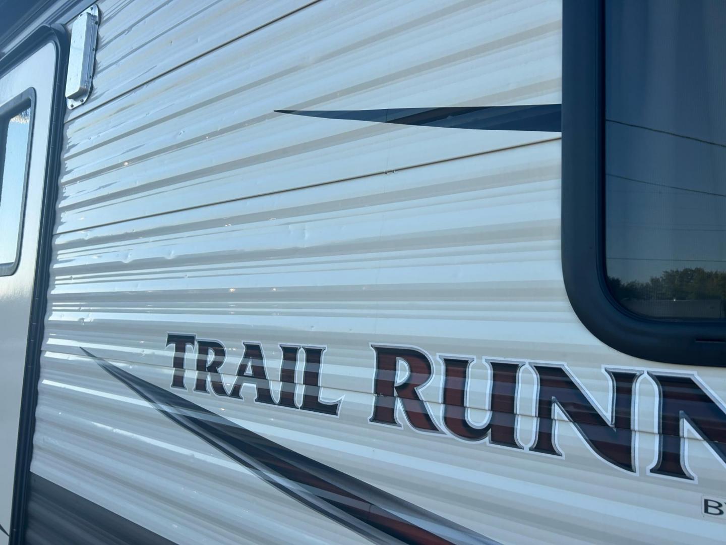 2017 White /TAN HEARTLAND TRAIL RUNNER TOY HAULER 26TH (5SFEB3027HE) , located at 17760 Hwy 62, Morris, OK, 74445, 35.609104, -95.877060 - WE HAVE THE PERFECT CAMPER FOR YOU TO CAMP AND HAUL YOUR TOYS IN. THIS IS A 2017 HEARTLAND TRAIL RUNNER OVERALL 30FT. IT FEATURES 17FT POWER AWNING, POWER JACK STABILIZERS, AMFM BLUETOOTH RADIO. IN THE FRONT YOU HAVE A QUEEN SIZED BED WITH STORAGE UNDERNEATH, OVERHEAD STORAGE, 2 WARDROBE CLOSETS, CO - Photo#29