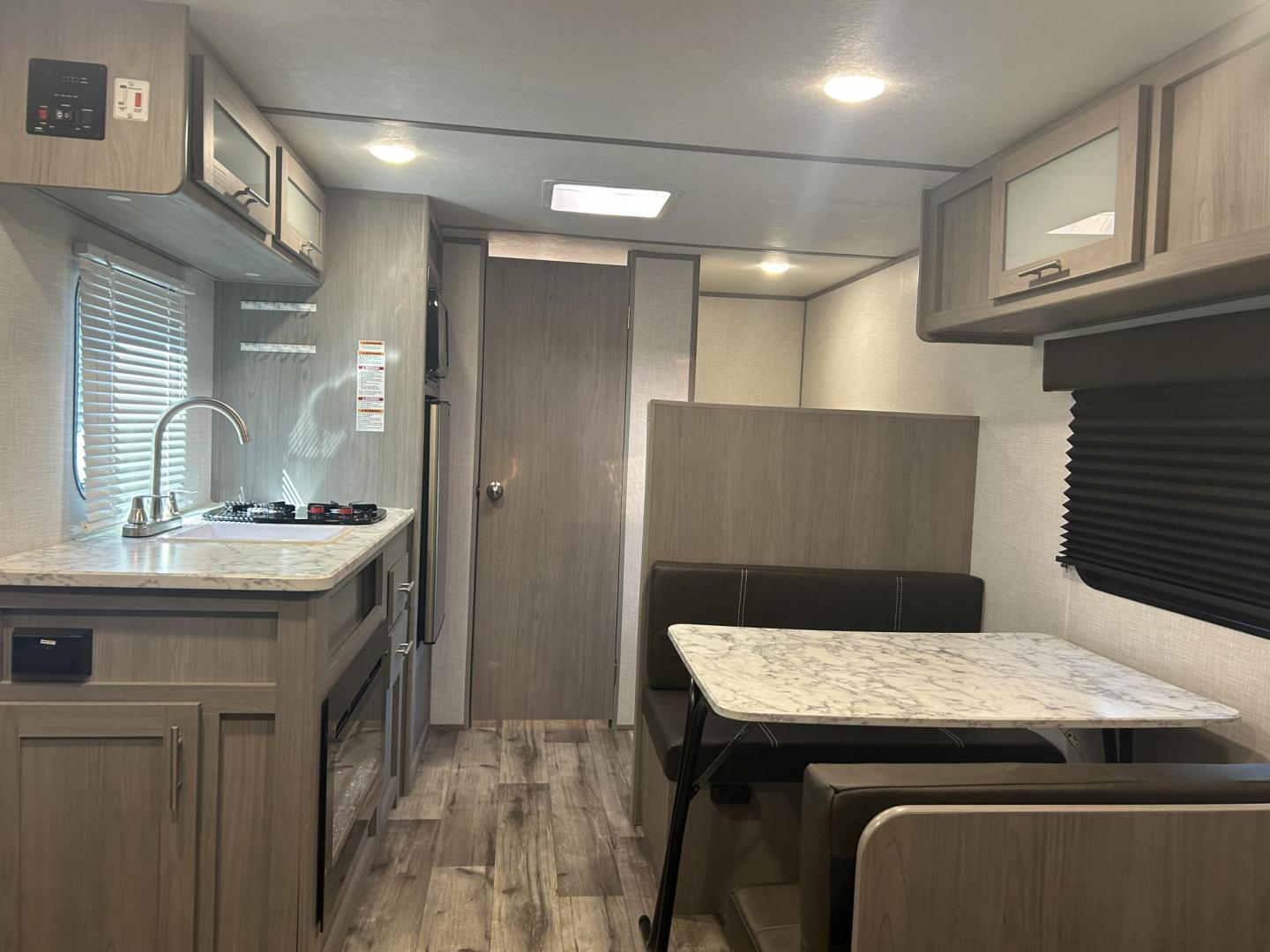 2023 Silver /TAN COLEMAN DUTCHMEN 17B (4YDTCMG17PJ) , located at 17760 Hwy 62, Morris, OK, 74445, 35.609104, -95.877060 - WE HAVE THE PERFECT CAMPER FOR YOU AND YOUR FAMILY. A 2023 COLEMAN DUTCHMEN OVERALL 21FT. IN THE FRONT YOU HAVE A QUEEN SIZED BED WITH STORAGE UNDERNEATH, OVERHEAD SHELF, IN THE MIDDLE IS A BOOTH STYLE DINETTE THAT FOLD DOWN FOR ADDITIONAL SLEEPING, OVERHEAD STORAGE, SINGLE SINK, 2 BURNER STOVE, MID - Photo#8