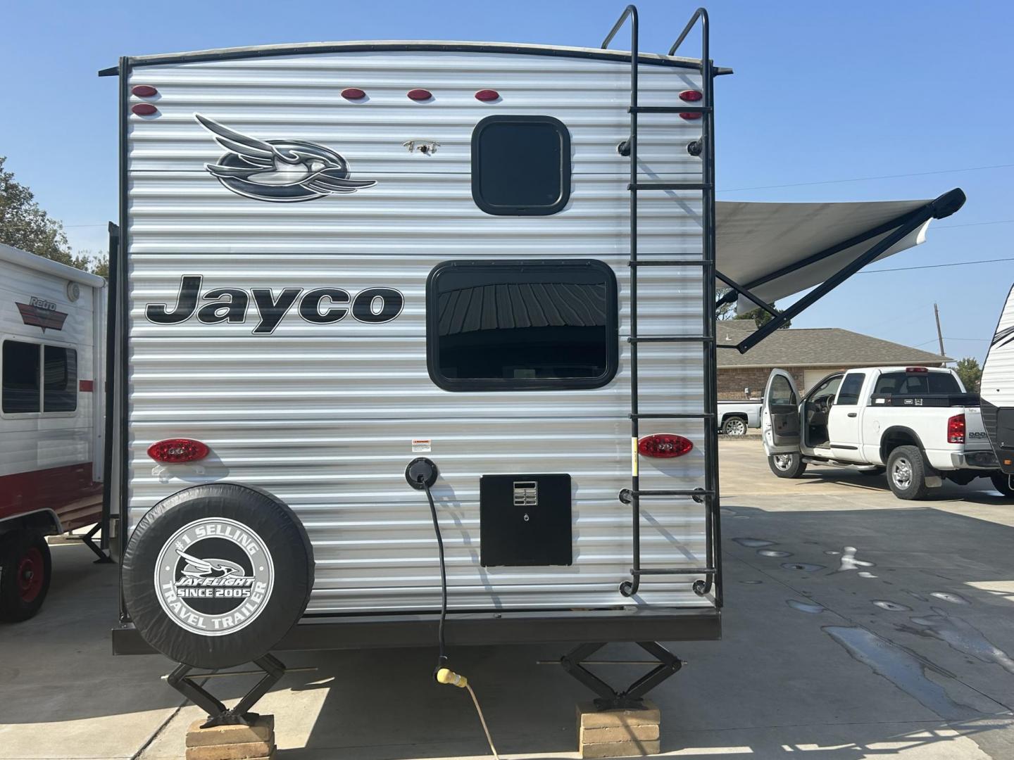 2021 Silver /Gray JAYCO JAY FLIGHT 267BHS (1UJBJ0BP5M1) , located at 17760 Hwy 62, Morris, OK, 74445, 35.609104, -95.877060 - WE HAVE A NICE FAMILY FRIENDLY CAMPER FOR YOU! IT'S PERFECT FOR A LAKE WEEKEND OR HUNTING TRIPS! THIS 2021 JAYCO JAY FLIGHT IS 30FT OVERALL. IN THE FRONT OF THE CAMPER YOU HAVE YOUR BEDROOM WITH QUEEN SIZE BED, OVERHEAD STORAGE WITH BLUE LED LIGHTS, STORAGE UNDERNEATH BED, 2 WARDROBE CLOSETS, IN THE - Photo#3