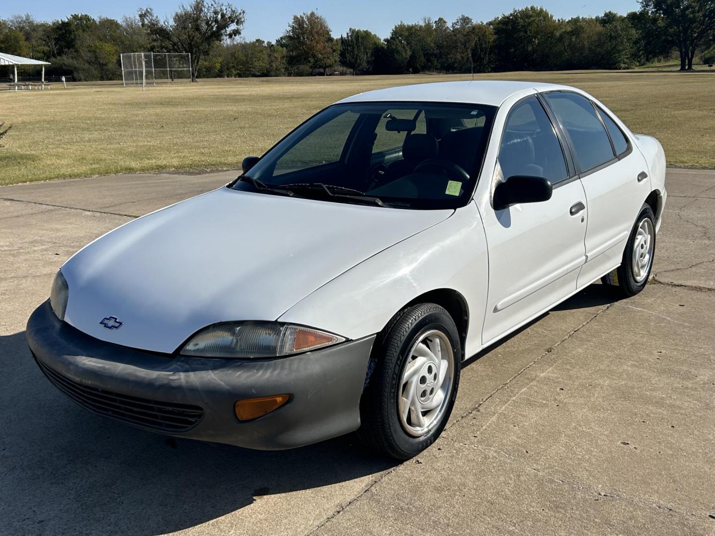 1999 White /BLACK Chevrolet Cavalier Sedan (3G1JC5240XS) with an 2.2L L4 OHV 8V engine, located at 17760 Hwy 62, Morris, OK, 74445, (918) 733-4887, 35.609104, -95.877060 - 1999 CHEVY CAVALIER HAS THE 2.2L L4 OHV 8V ENGINE. THIS IS A BI-FUEL SYSTEM THAT RUNS ON CNG OR GASOLINE. IT FEATURES AM/FM RADIO, MANUAL SEATS, MANUAL LOCKS, MANUAL WINDOWS, AND CLOTH INTERIOR. EQUIPPED WITH A IMPCO BI-FUEL CNG FUEL SYSTEM. IT RUNS ON COMPRESSED NATURAL GAS OR GASOLINE. A PREMIER A - Photo#2