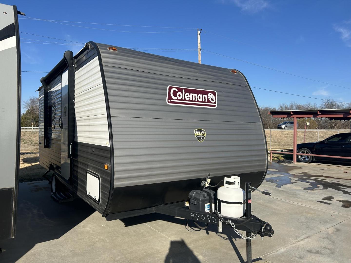 2023 Silver /TAN Keystone COLEMAN 17R 17R (4YDTCMG10PH) , located at 17760 Hwy 62, Morris, OK, 74445, 35.609104, -95.877060 - 2023 KEYSTONE COLEMAN DUTCHMEN 21.42FT OVERALL WITH 8FT POWER AWNING (APPEARS TO BE NEVER USED) IN THE FRONT OF THE CAMPER IS YOUR QUEEN SIZE BED WITH STORAGE UNDERNEATH, OVERHEAD SHELF, WINDOW A/C UNIT. KITCHEN/LIVING AREA IS A BOOTH STYLE DINETTE THAT FOLDS DOWN FOR ADDITIONAL SLEEPING, OVERHEAD C - Photo#1