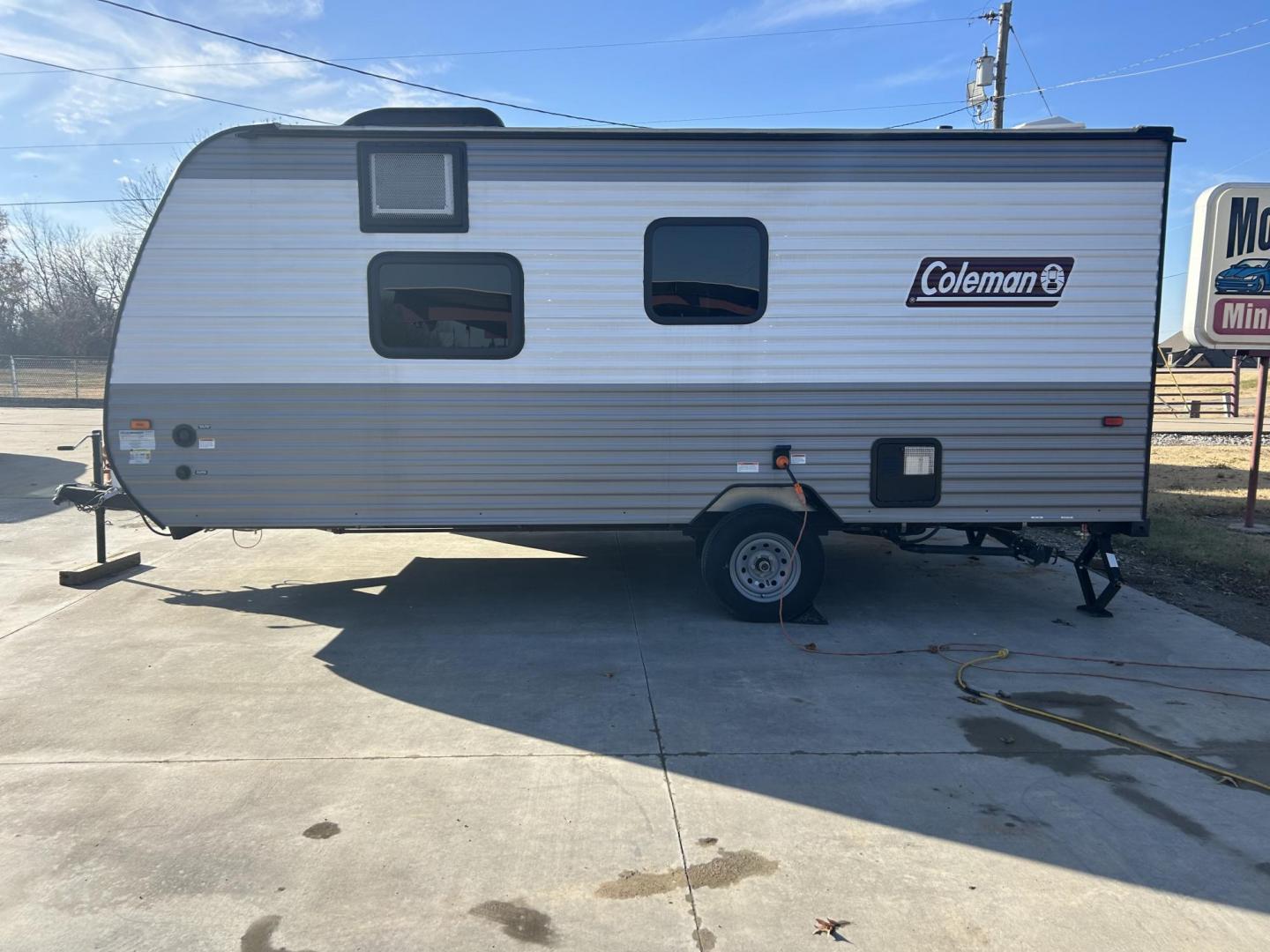 2023 Silver /TAN Keystone COLEMAN 17R 17R (4YDTCMG10PH) , located at 17760 Hwy 62, Morris, OK, 74445, 35.609104, -95.877060 - 2023 KEYSTONE COLEMAN DUTCHMEN 21.42FT OVERALL WITH 8FT POWER AWNING (APPEARS TO BE NEVER USED) IN THE FRONT OF THE CAMPER IS YOUR QUEEN SIZE BED WITH STORAGE UNDERNEATH, OVERHEAD SHELF, WINDOW A/C UNIT. KITCHEN/LIVING AREA IS A BOOTH STYLE DINETTE THAT FOLDS DOWN FOR ADDITIONAL SLEEPING, OVERHEAD C - Photo#3